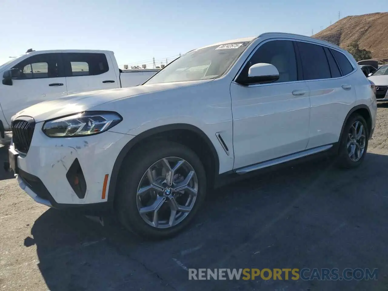 1 Photograph of a damaged car 5UX43DP04N9J44674 BMW X3 2022