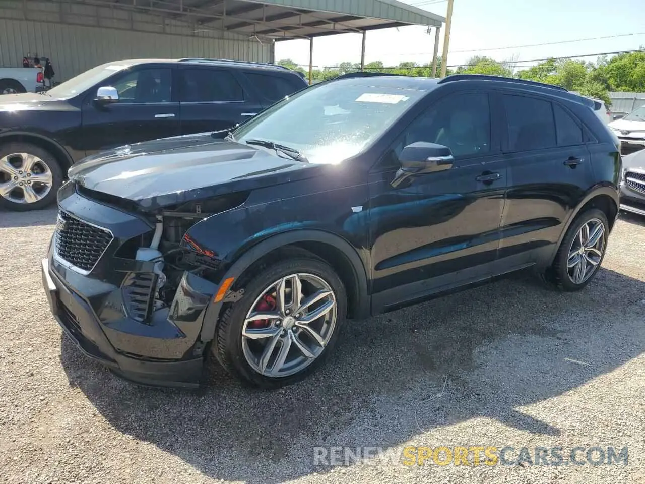1 Photograph of a damaged car 1GYFZER44MF015908 CADILLAC XT4 2021