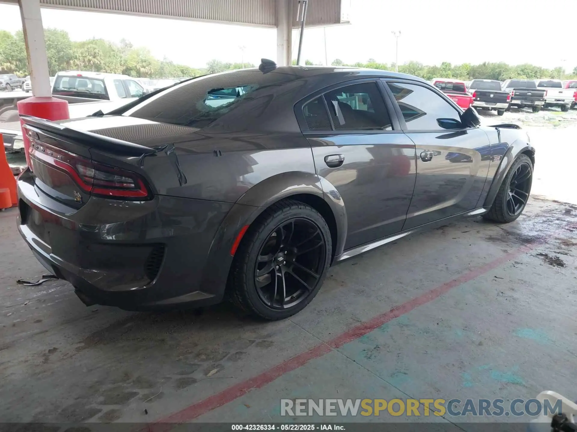 4 Photograph of a damaged car 2C3CDXGJXPH684817 DODGE CHARGER 2023