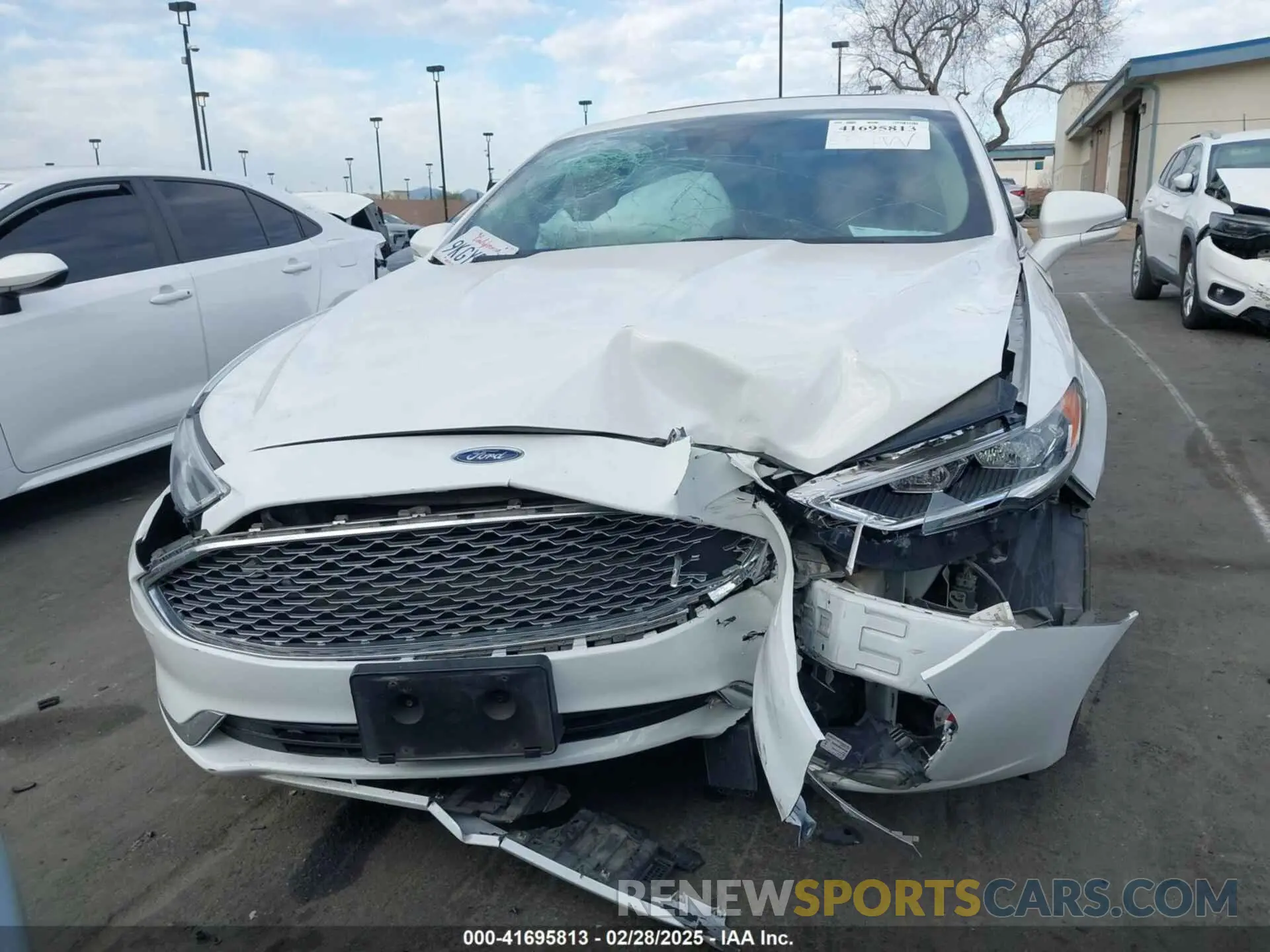 12 Photograph of a damaged car 3FA6P0RU2KR104817 FORD FUSION HYBRID 2019