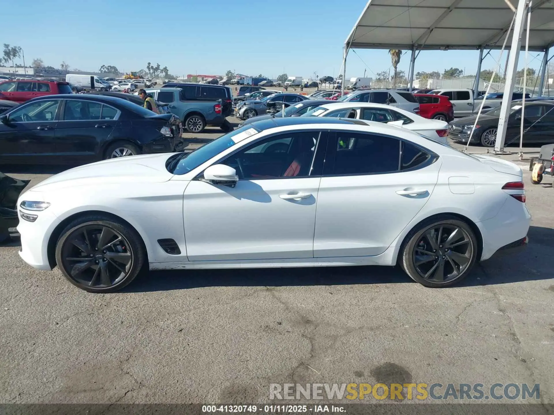 14 Photograph of a damaged car KMTG34TAXPU112861 GENESIS G70 2023
