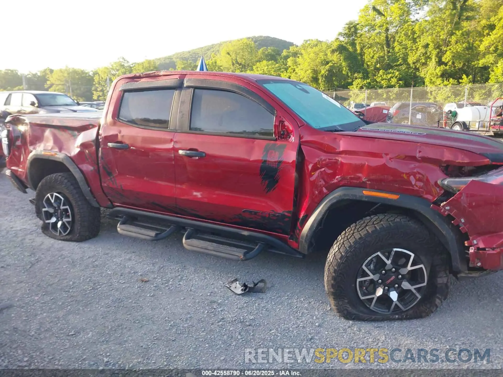 12 Photograph of a damaged car 1GTP6EEK9P1153310 GMC CANYON 2023