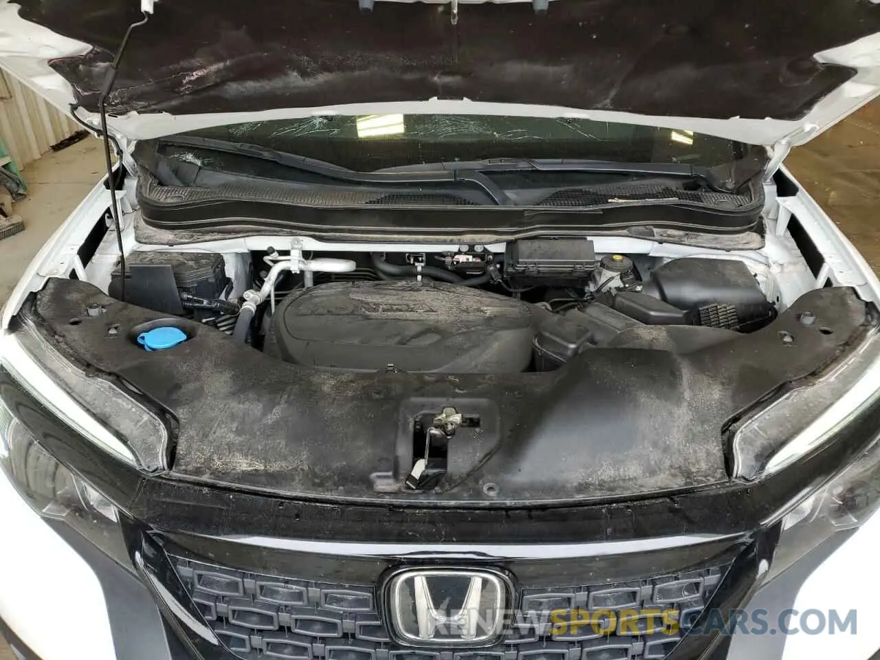 12 Photograph of a damaged car 5FNYF8H23MB015931 HONDA PASSPORT 2021