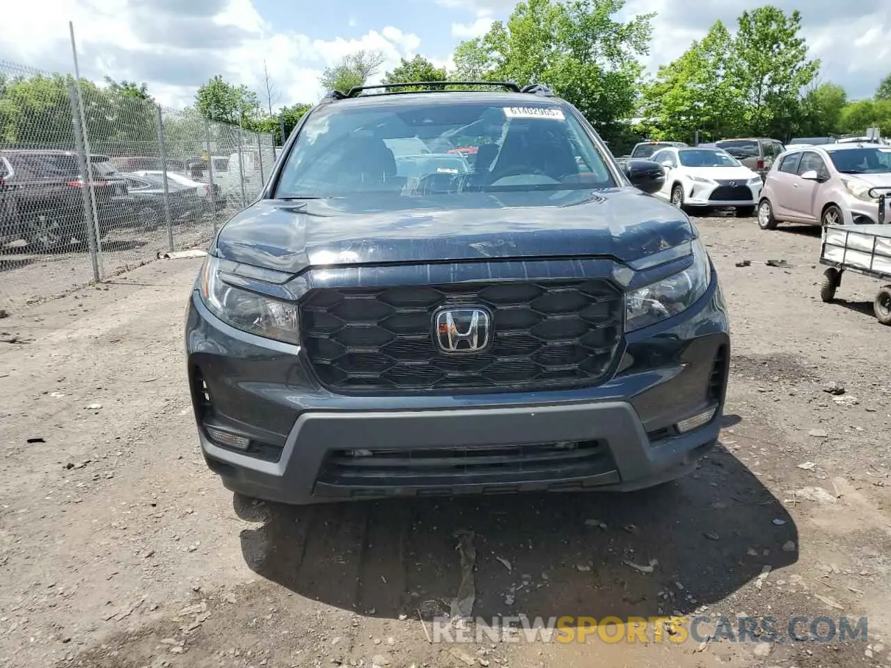 5 Photograph of a damaged car 5FNYF8H01PB030270 HONDA PASSPORT 2023
