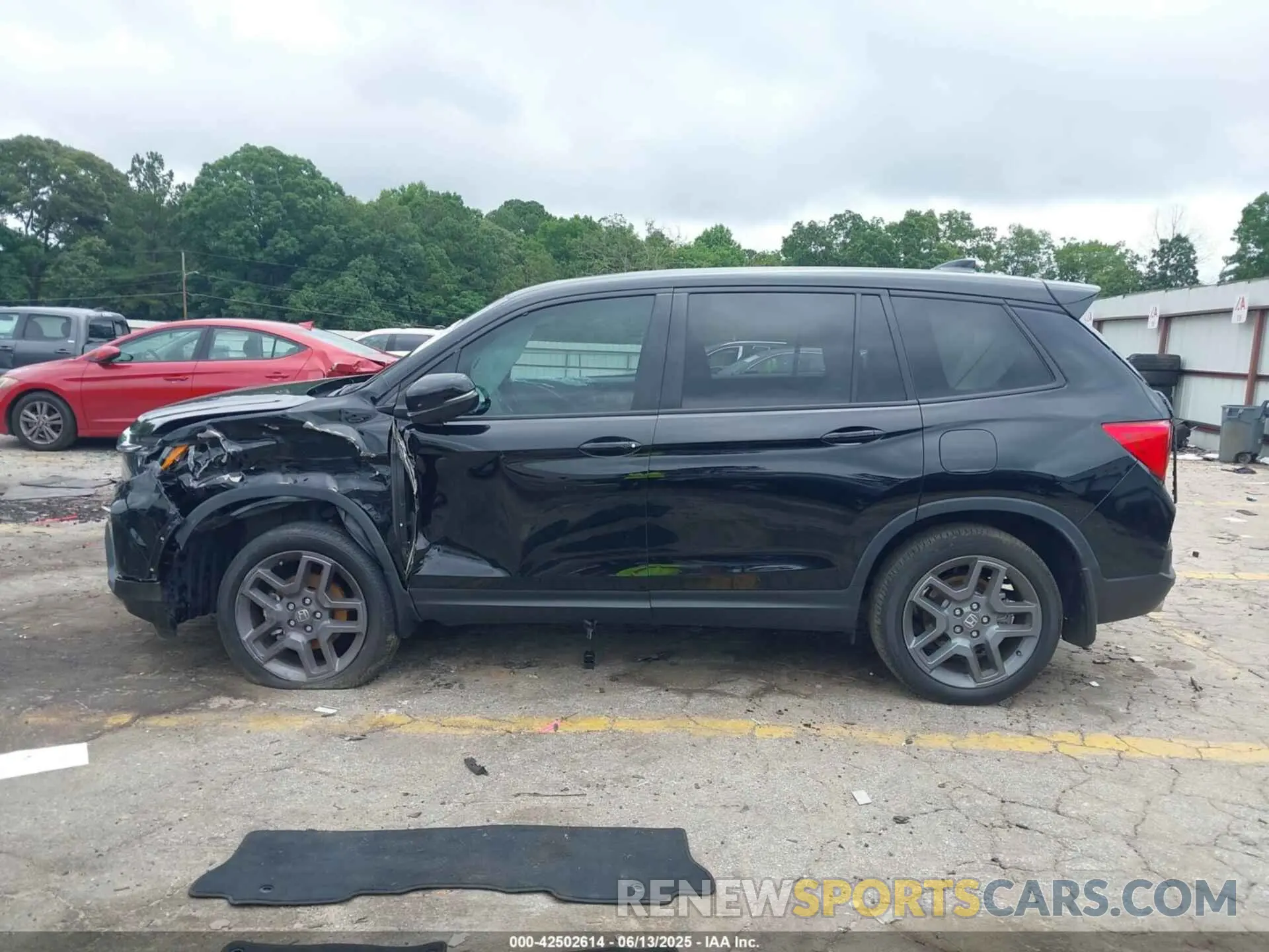 13 Photograph of a damaged car 5FNYF8H56PB009779 HONDA PASSPORT 2023