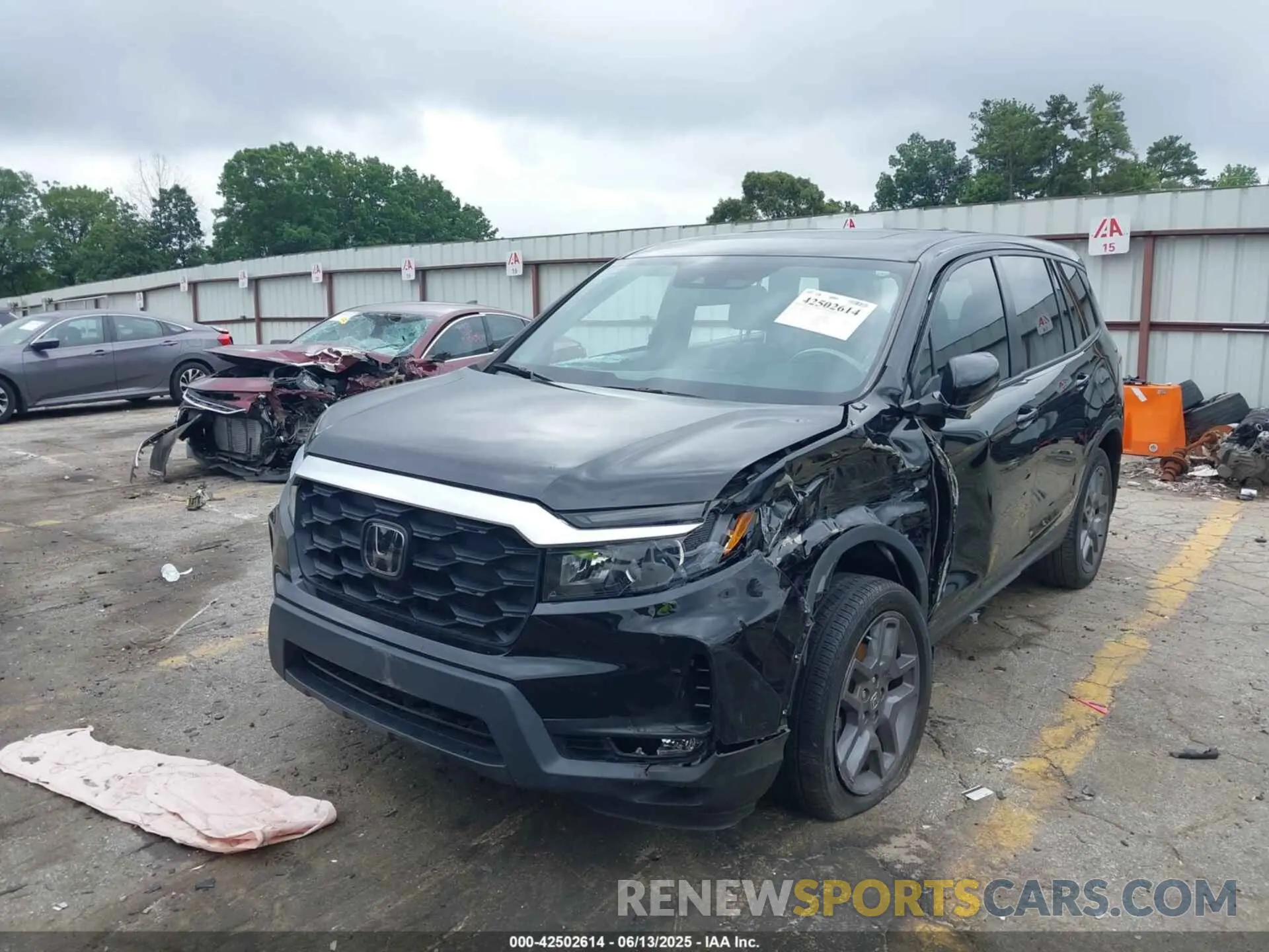 2 Photograph of a damaged car 5FNYF8H56PB009779 HONDA PASSPORT 2023