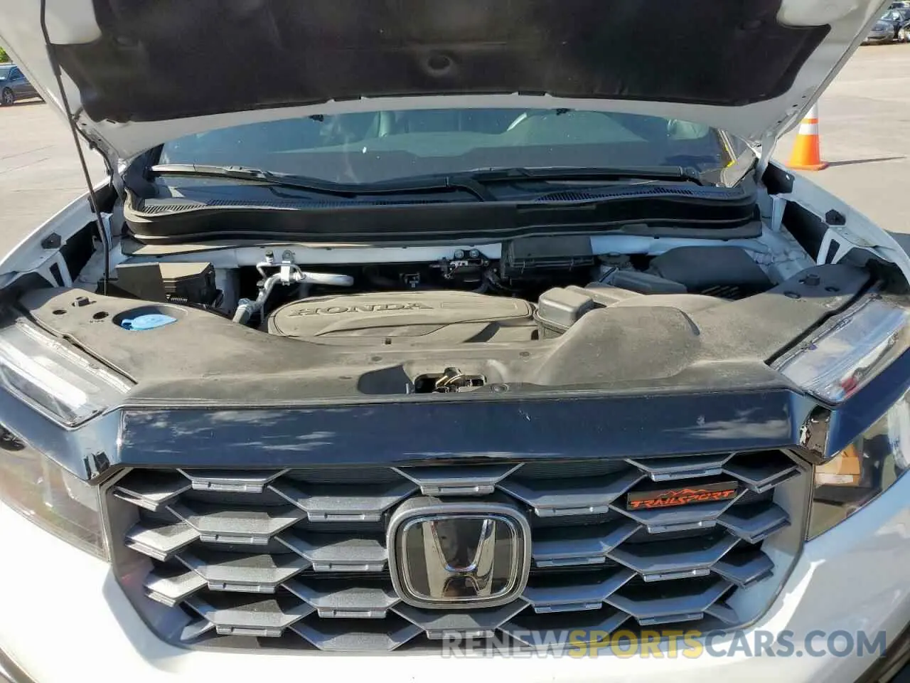 12 Photograph of a damaged car 5FNYF8H64PB007652 HONDA PASSPORT 2023