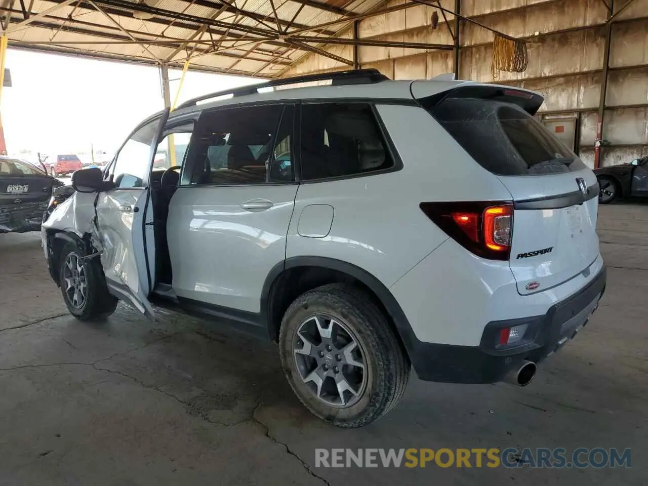 2 Фотография поврежденного автомобиля 5FNYF8H68PB000476 HONDA PASSPORT 2023