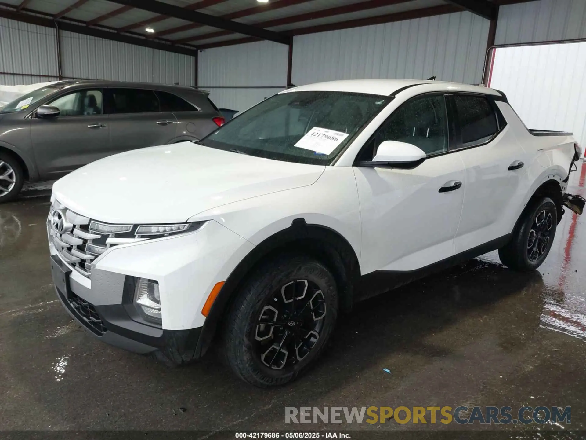 2 Photograph of a damaged car 5NTJADAE9NH028880 HYUNDAI SANTA CRUZ 2022