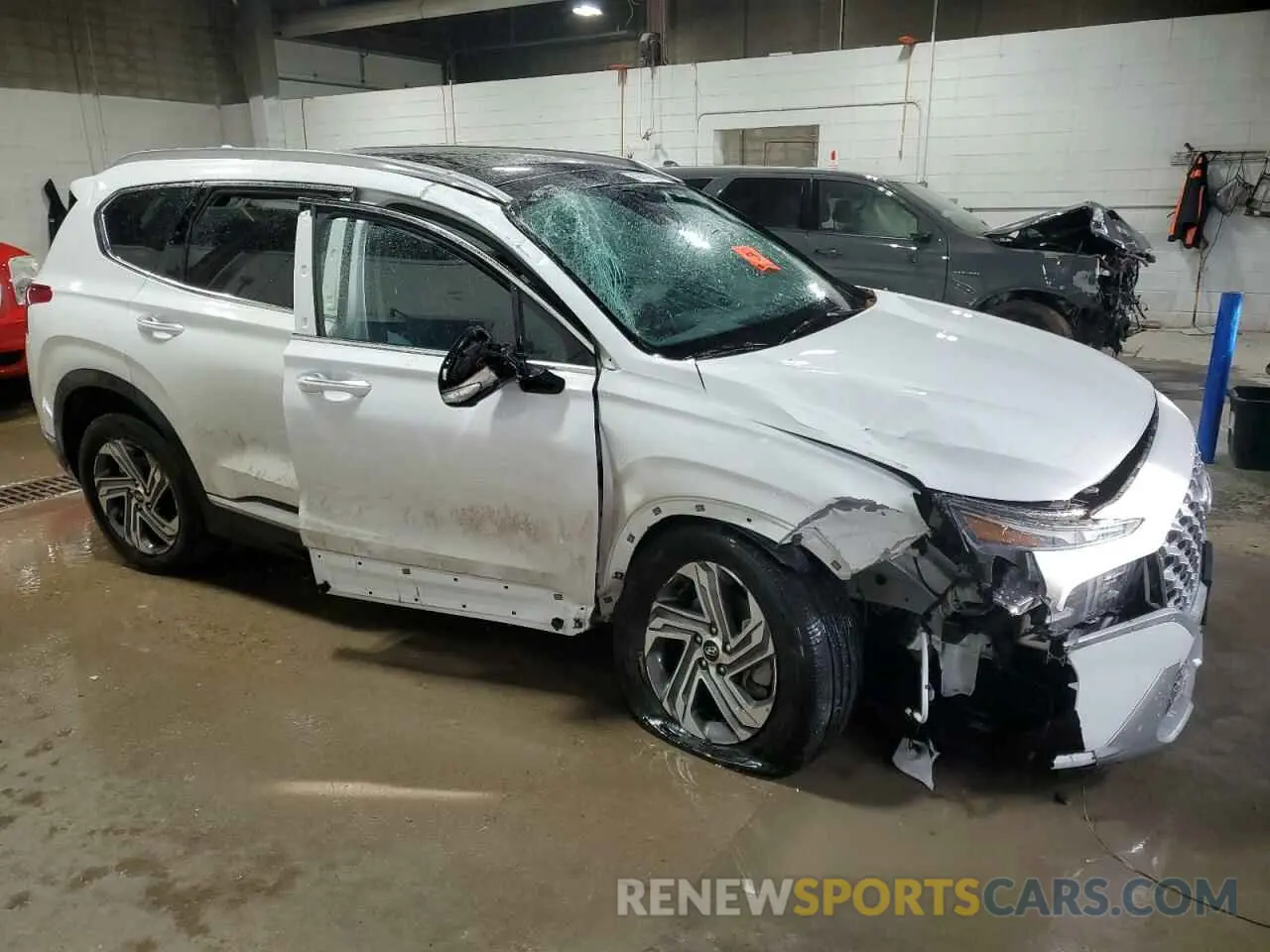 4 Photograph of a damaged car 5NMS3DAJ0PH657857 HYUNDAI SANTA FE 2023