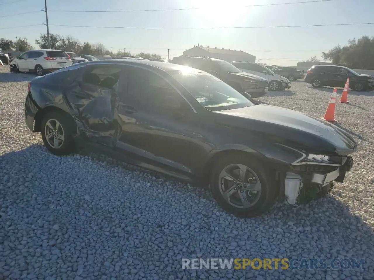 4 Photograph of a damaged car 5XXG14J24NG120599 KIA K5 2022