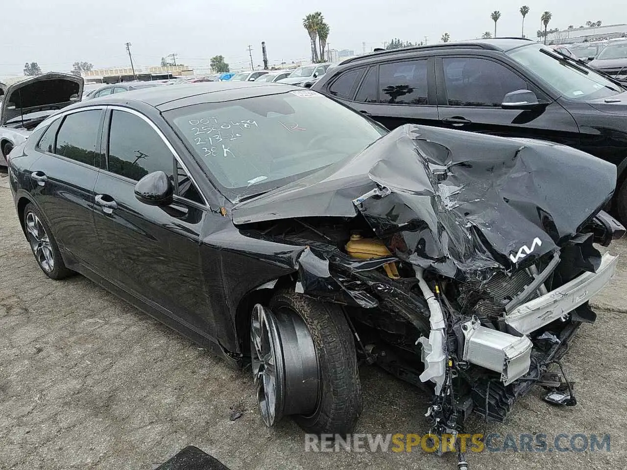 4 Photograph of a damaged car 5XXG34J20NG089992 KIA K5 2022