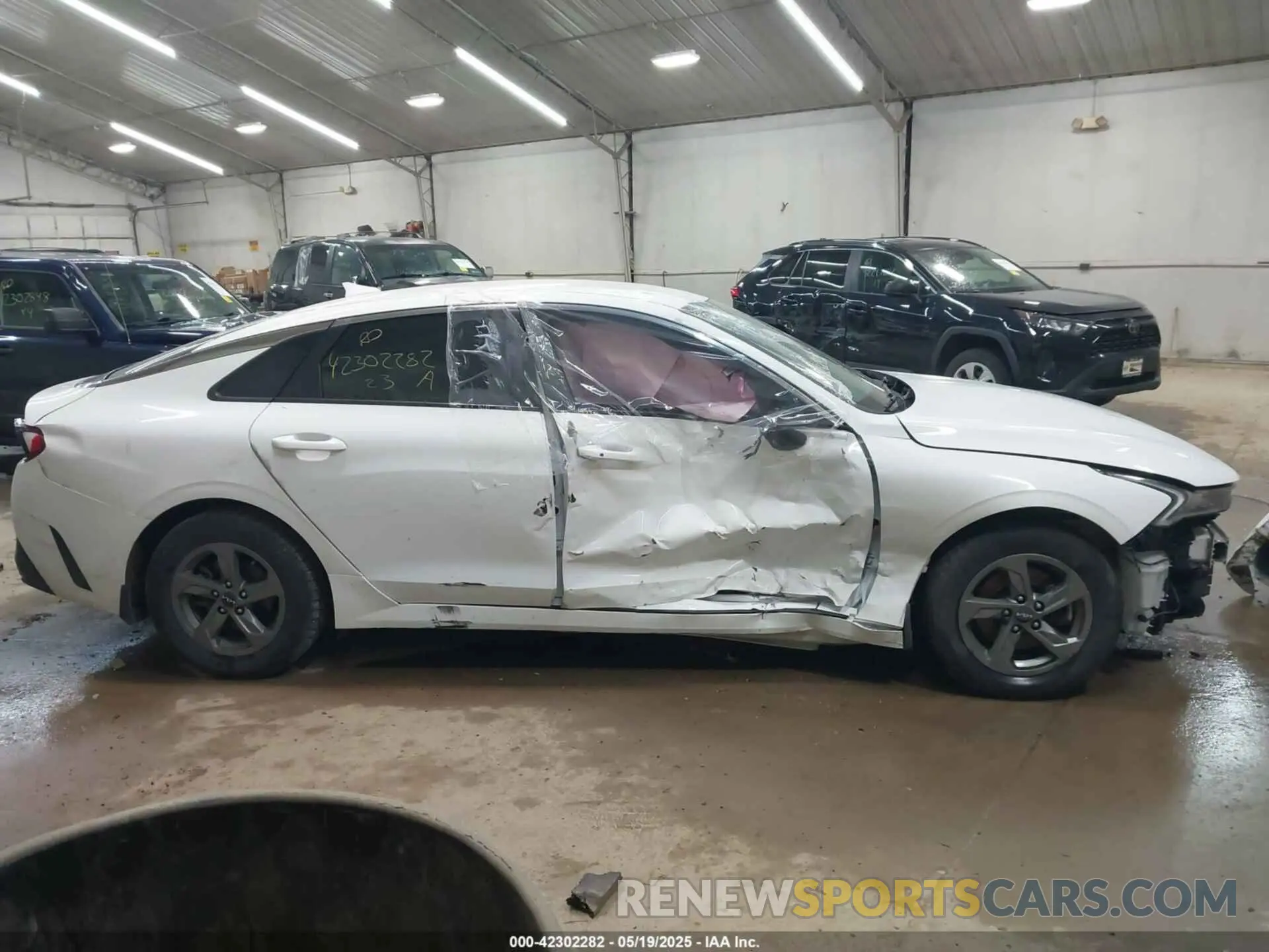 13 Photograph of a damaged car 5XXG14J25PG183200 KIA K5 2023