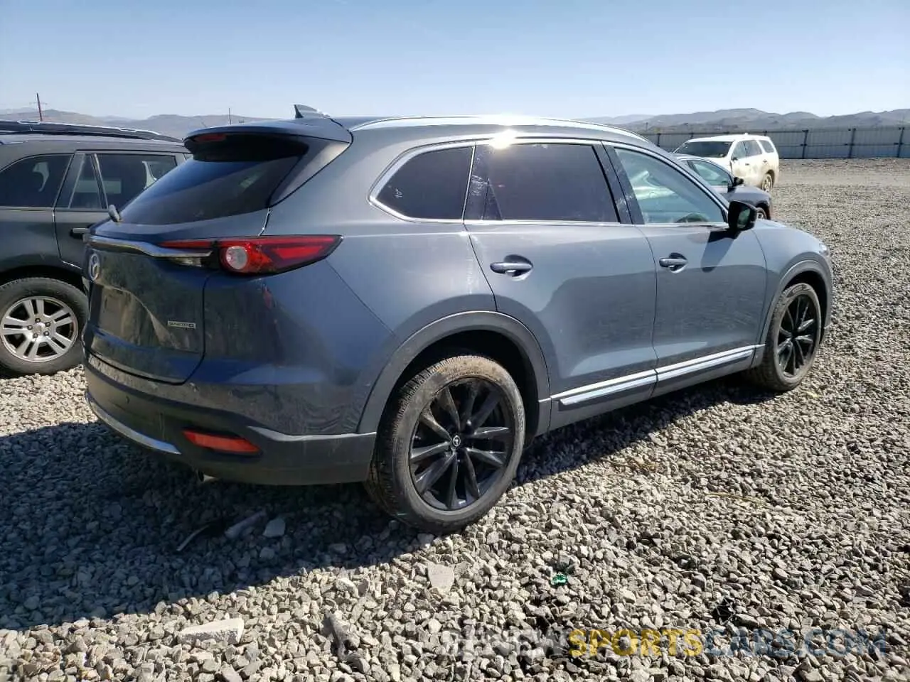 3 Фотография поврежденного автомобиля JM3TCBDY5N0628165 MAZDA CX-9 2022