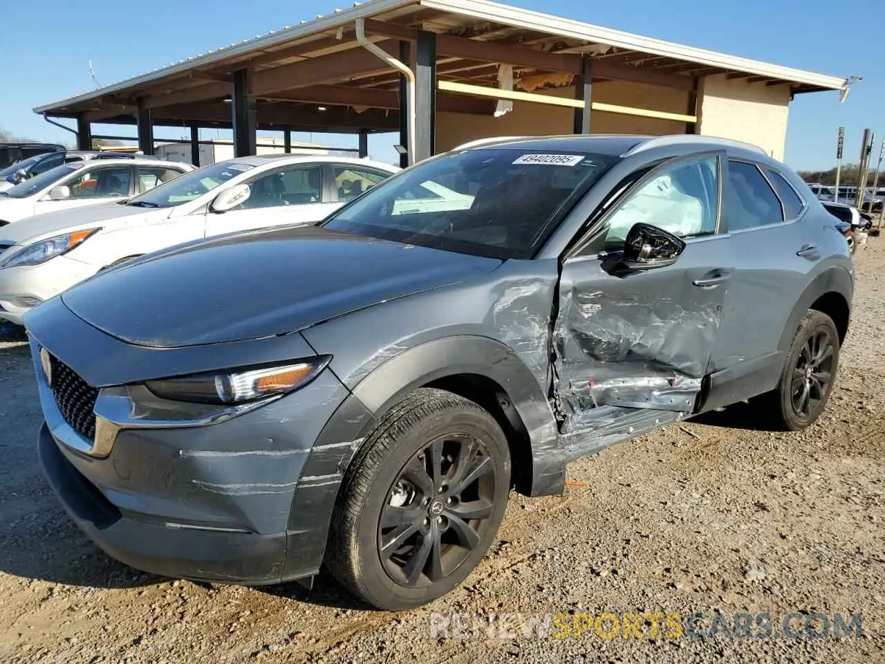 1 Photograph of a damaged car 3MVDMBCMXPM558346 MAZDA CX30 2023