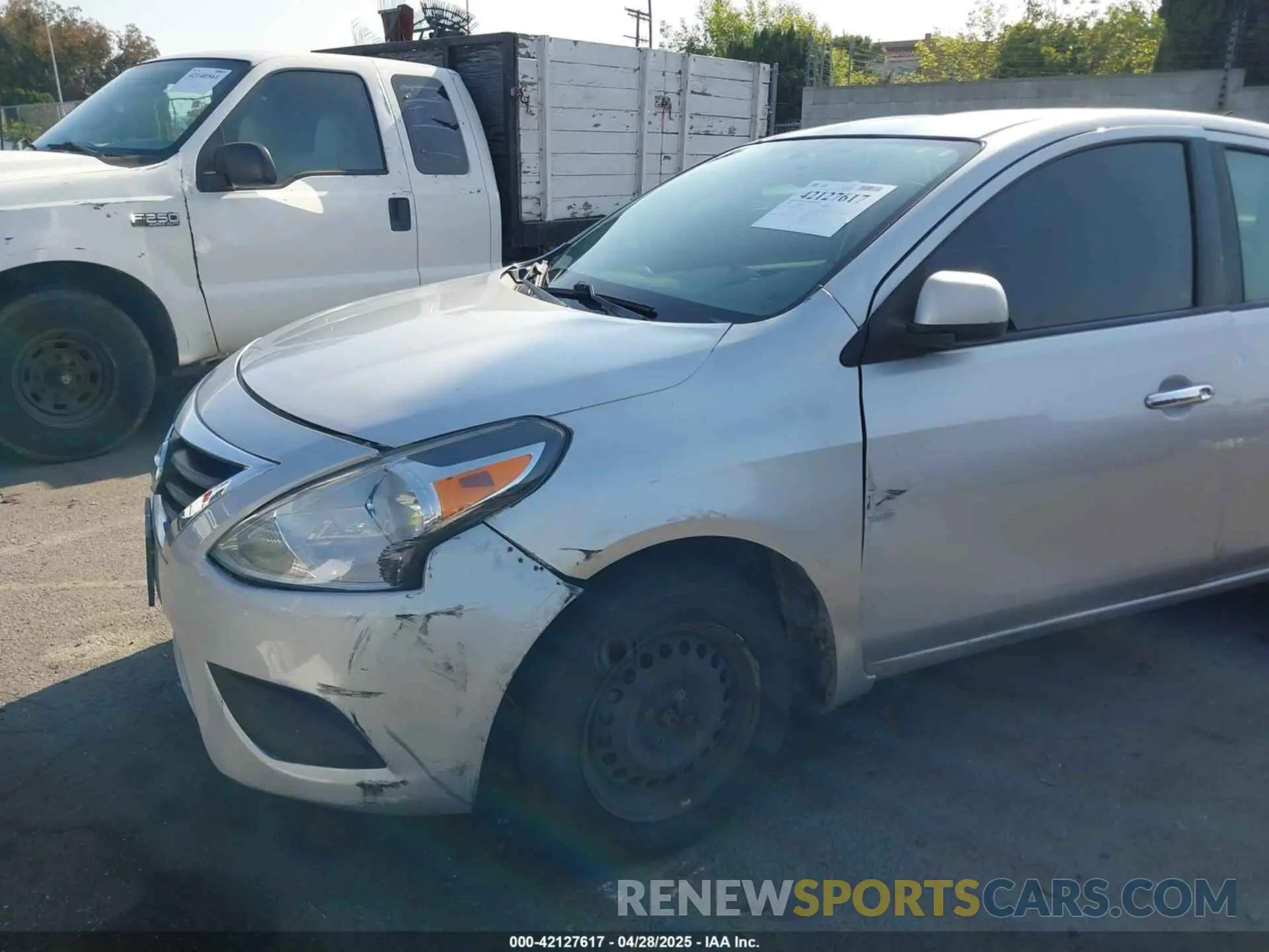 18 Photograph of a damaged car 3N1CN7AP2KL843581 NISSAN VERSA 2019