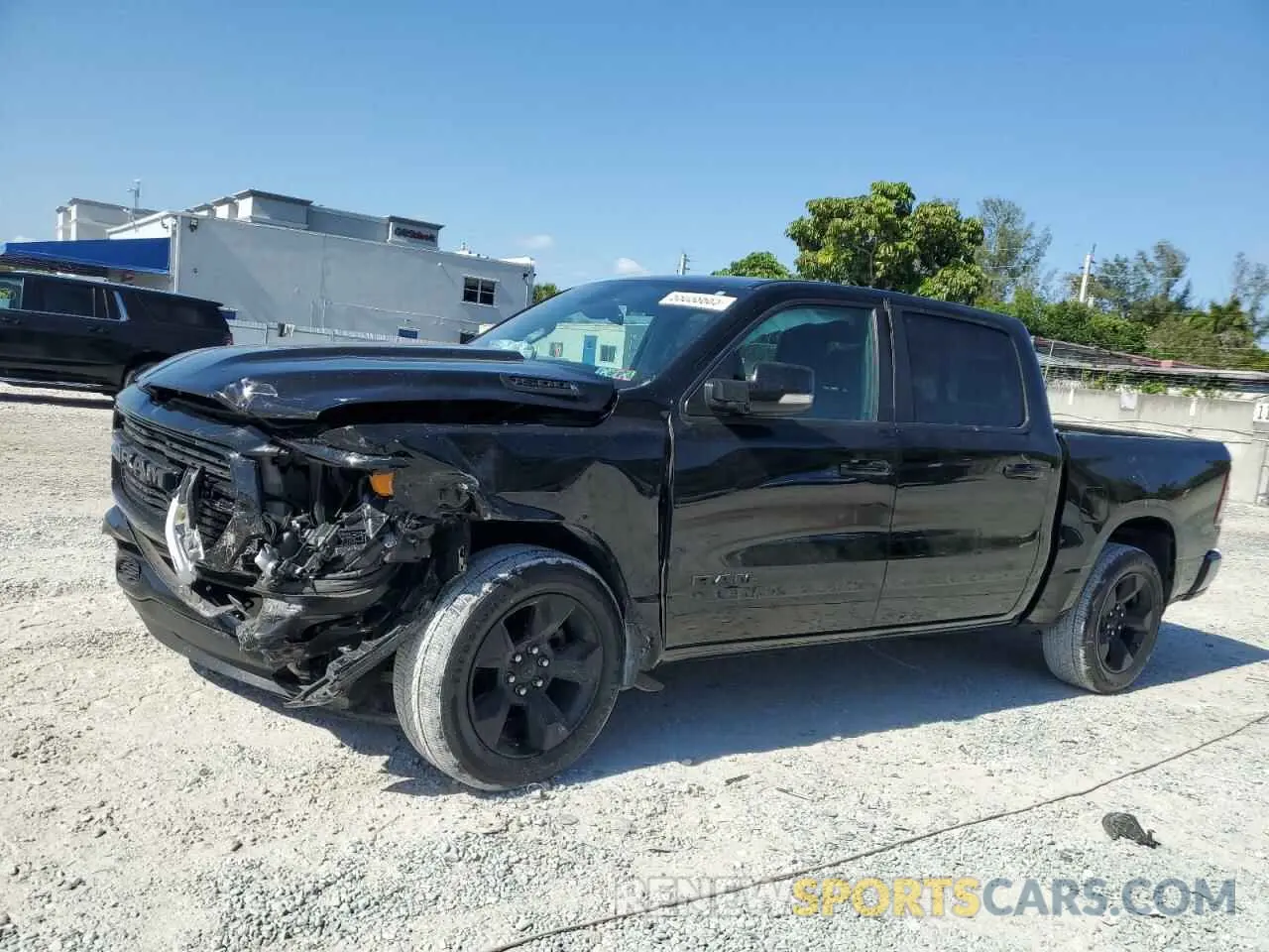 1 Photograph of a damaged car 1C6RRFFG0KN857081 RAM 1500 2019