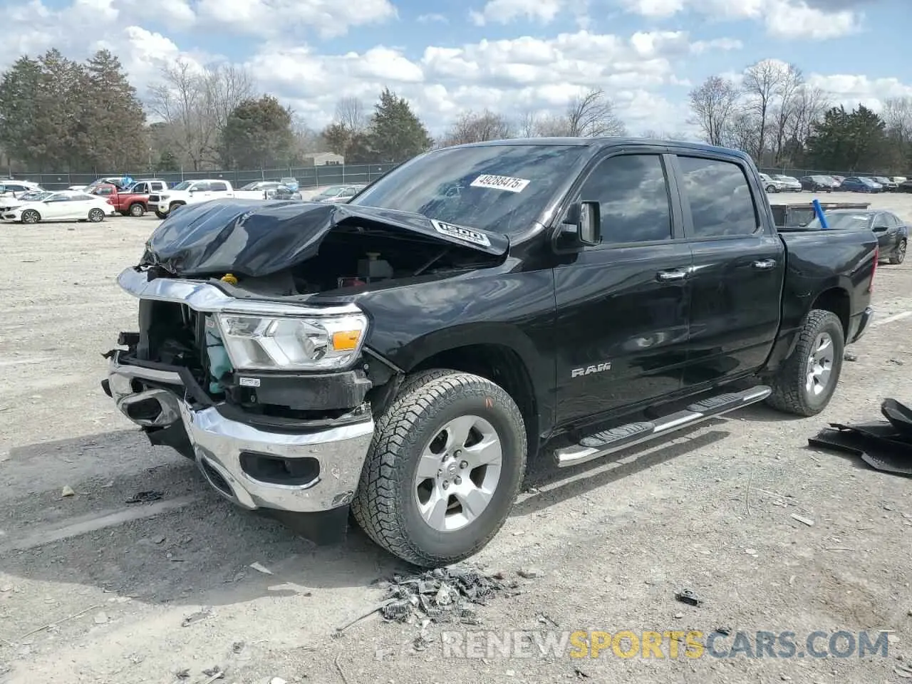 1 Photograph of a damaged car 1C6SRFFT5KN823779 RAM 1500 2019