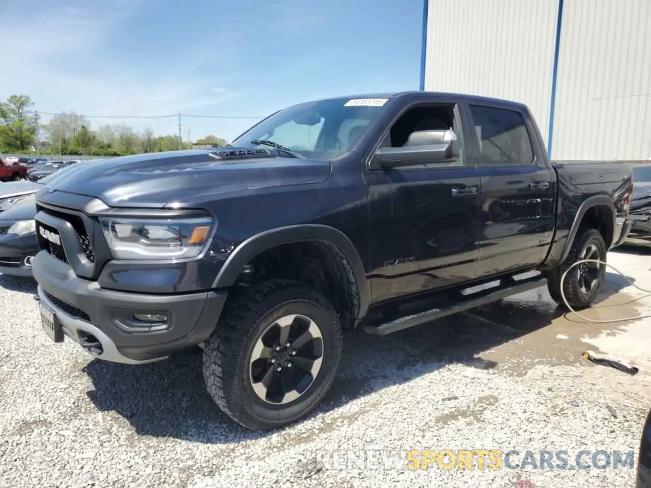 1 Photograph of a damaged car 1C6SRFLT6KN615351 RAM 1500 2019