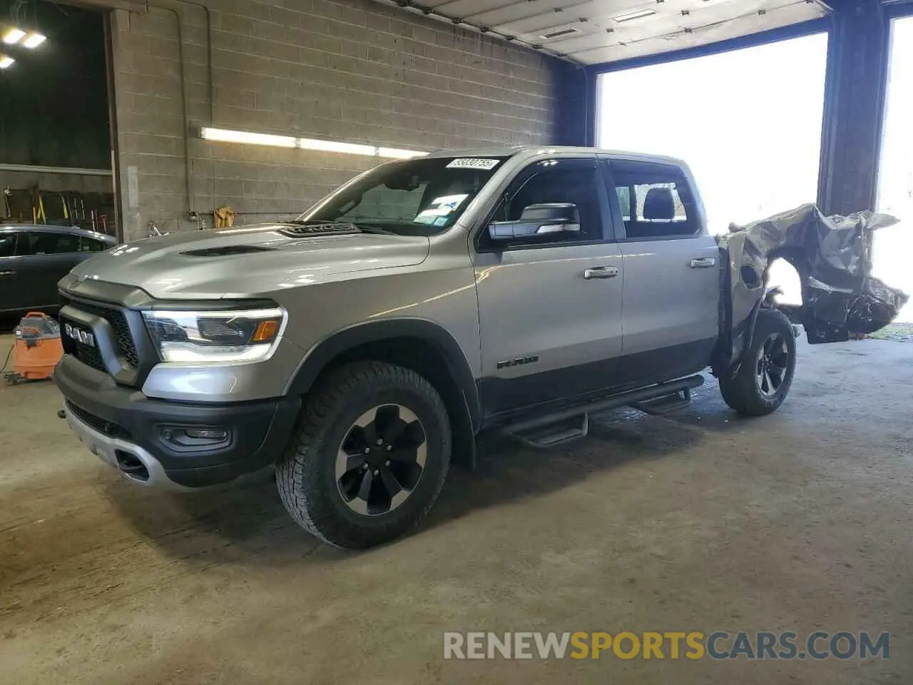 1 Photograph of a damaged car 1C6SRFLT8KN551135 RAM 1500 2019