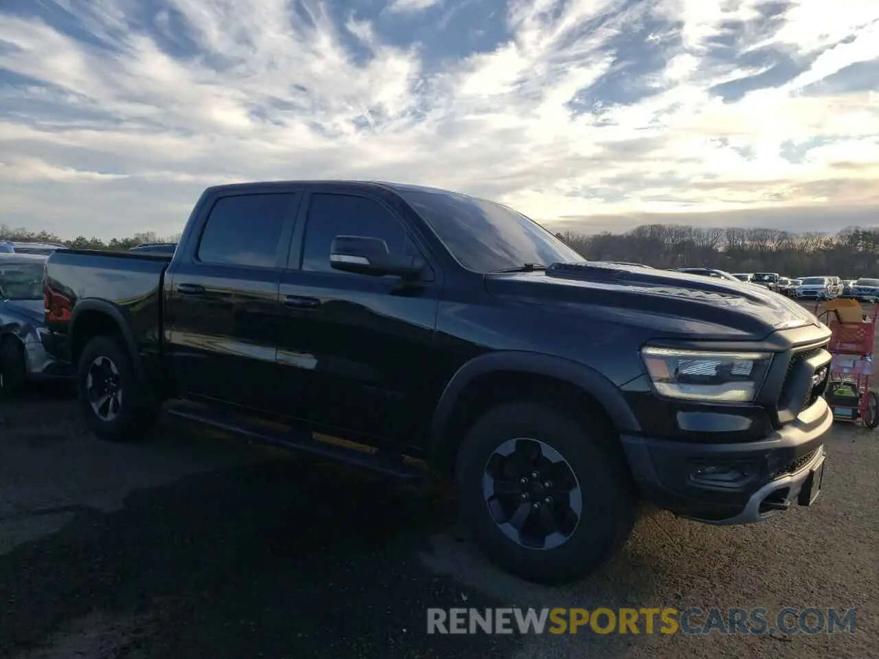 4 Photograph of a damaged car 1C6SRFLT9KN565450 RAM 1500 2019