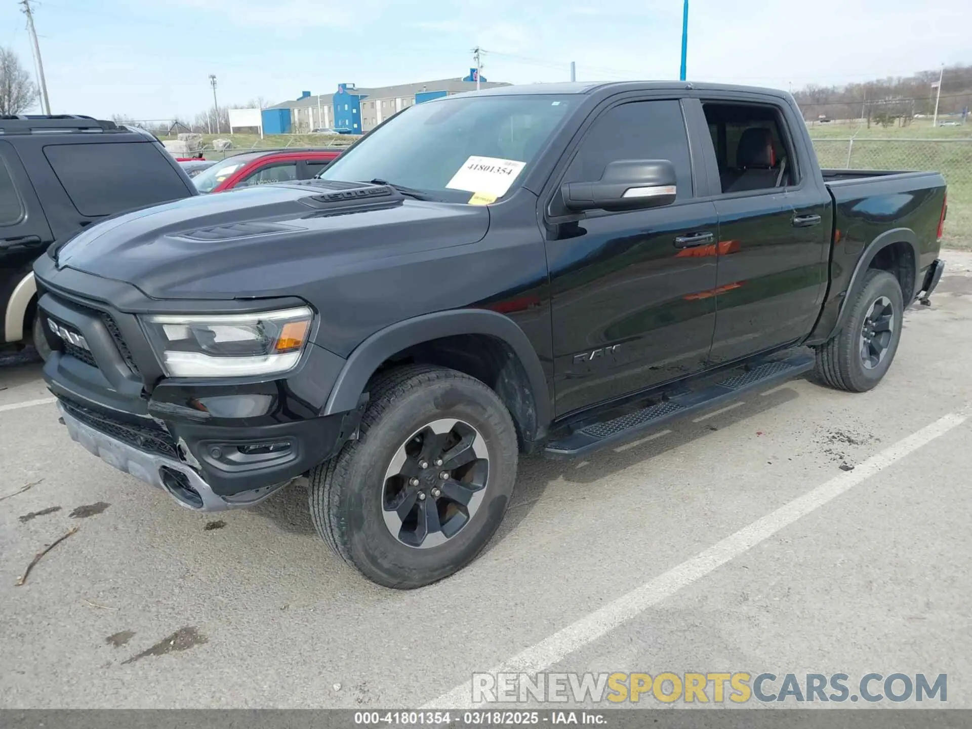 2 Photograph of a damaged car 1C6SRFLT9KN690335 RAM 1500 2019