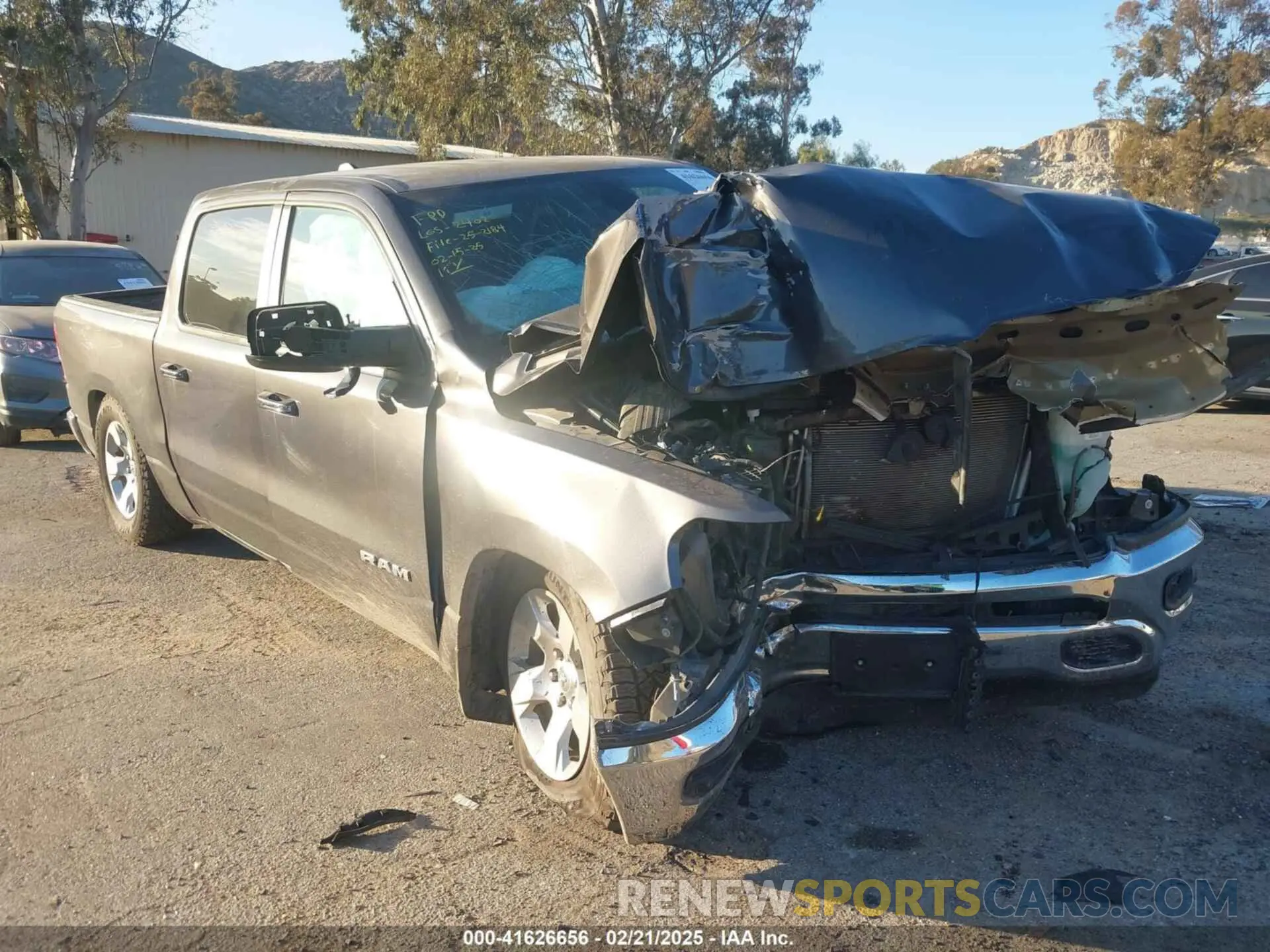 1 Photograph of a damaged car 1C6RREFT4LN372628 RAM 1500 2020