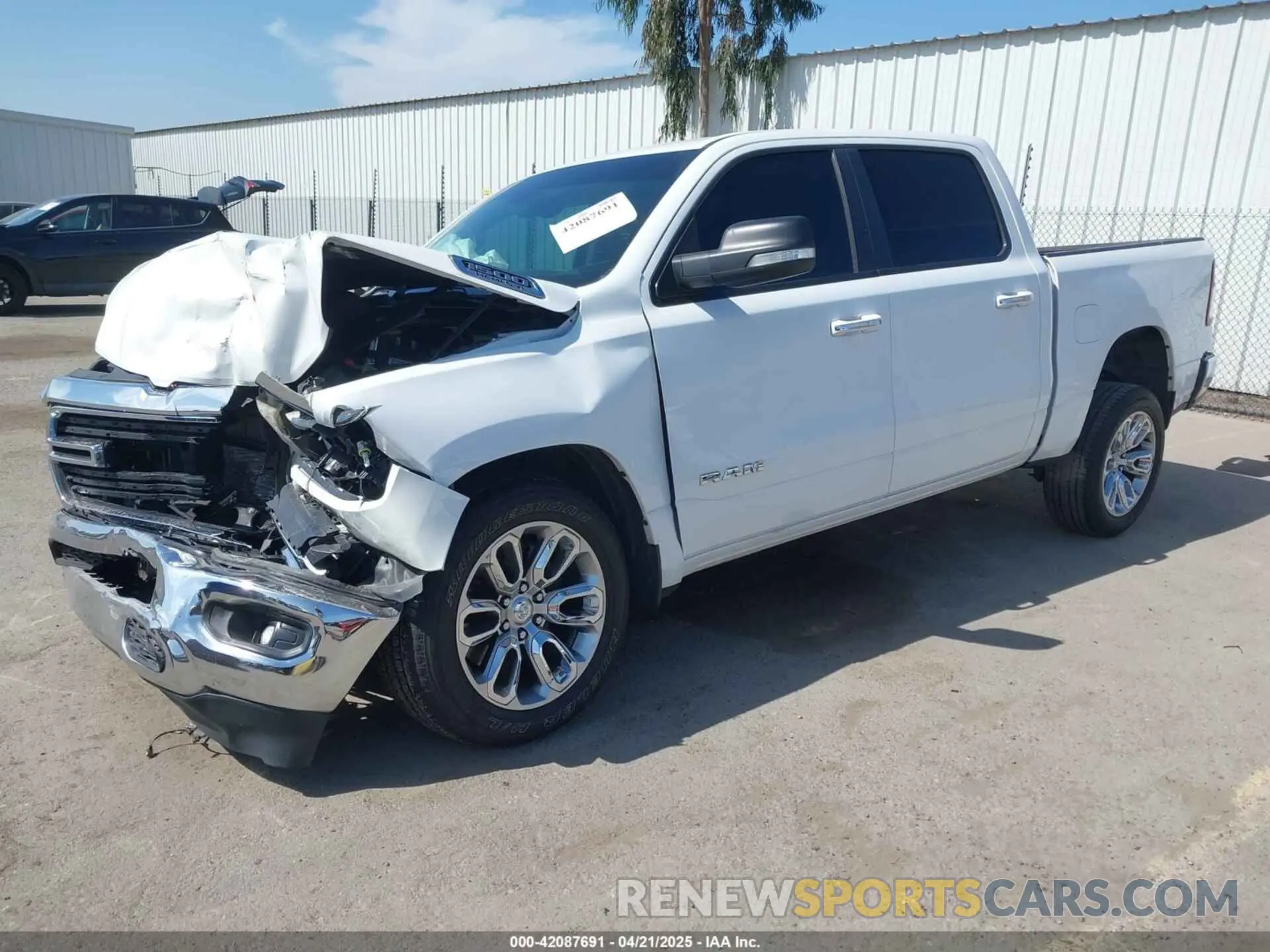 2 Photograph of a damaged car 1C6RREFT6LN100386 RAM 1500 2020