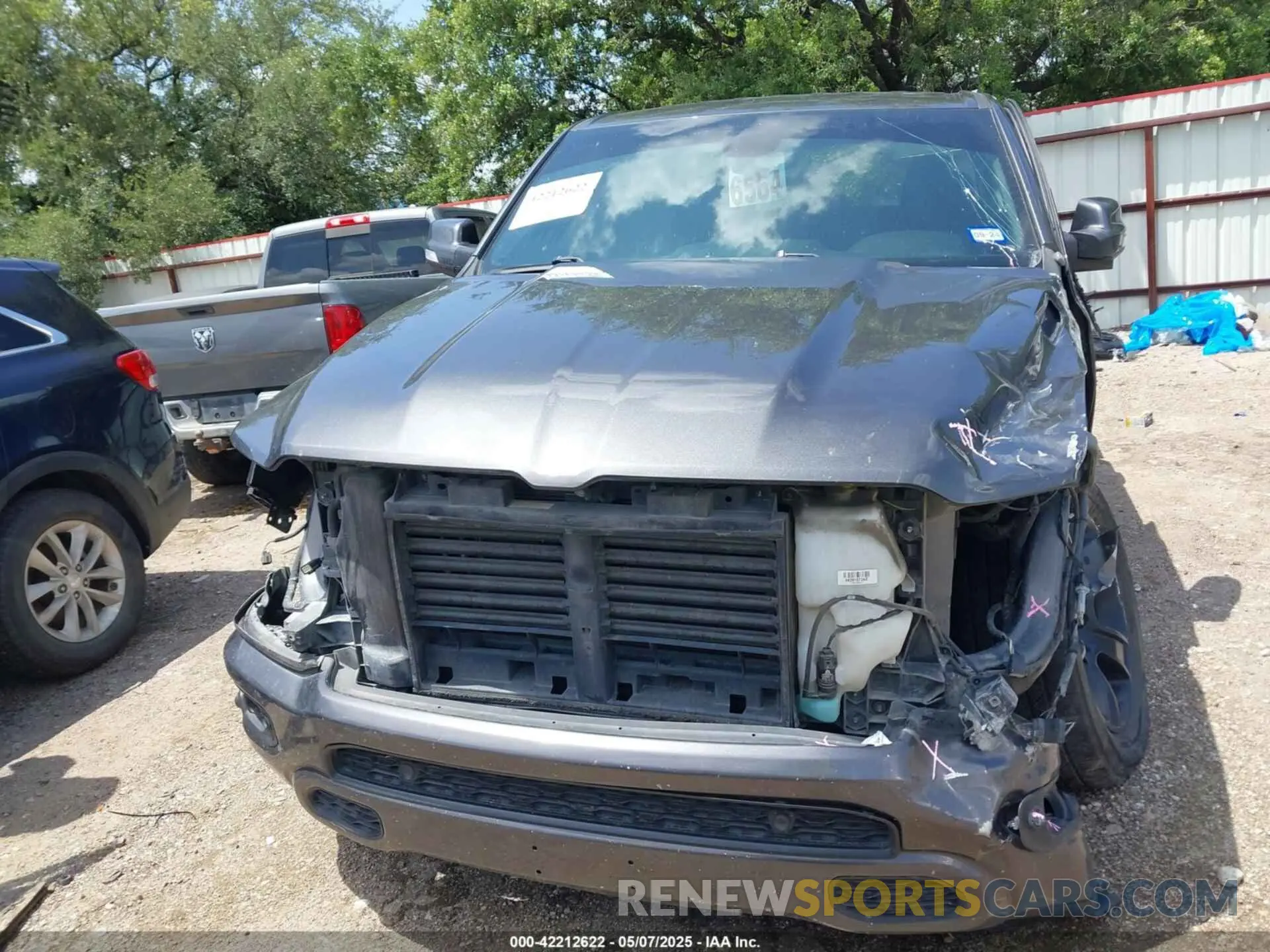 13 Photograph of a damaged car 1C6RREFT7LN121697 RAM 1500 2020