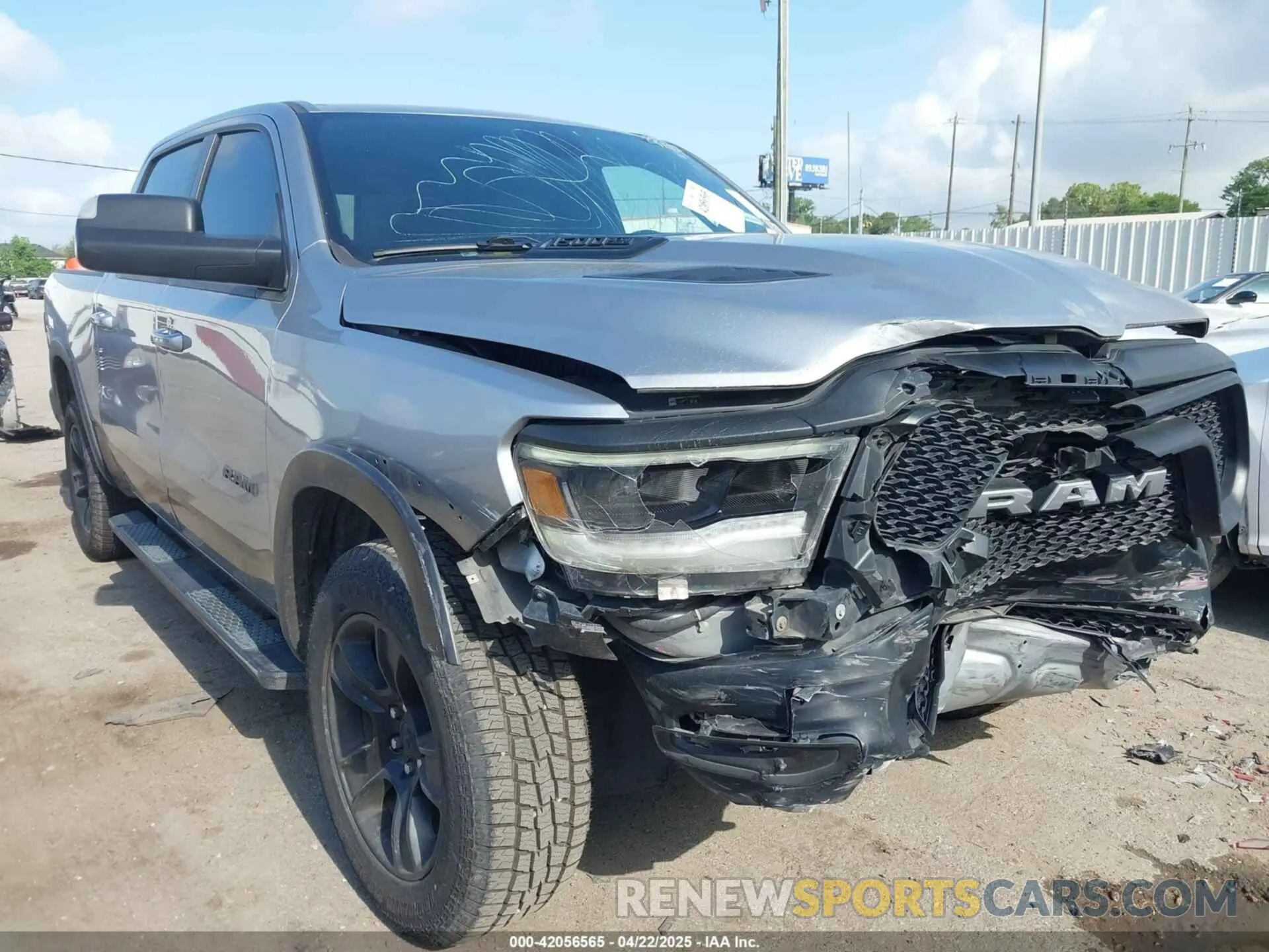 1 Photograph of a damaged car 1C6RRELT4LN267060 RAM 1500 2020