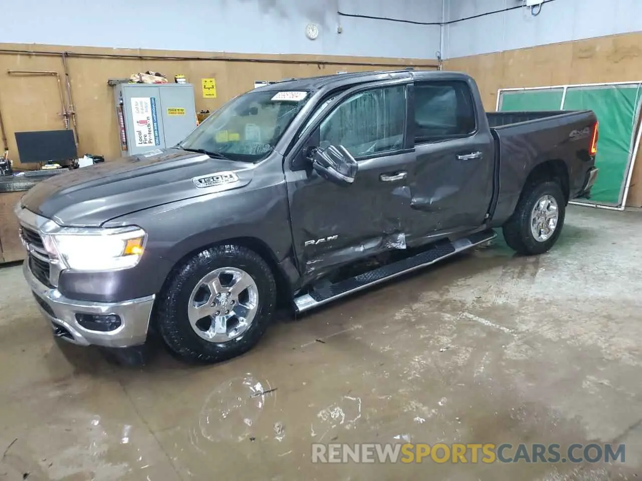 1 Photograph of a damaged car 1C6SRFFT0LN113481 RAM 1500 2020