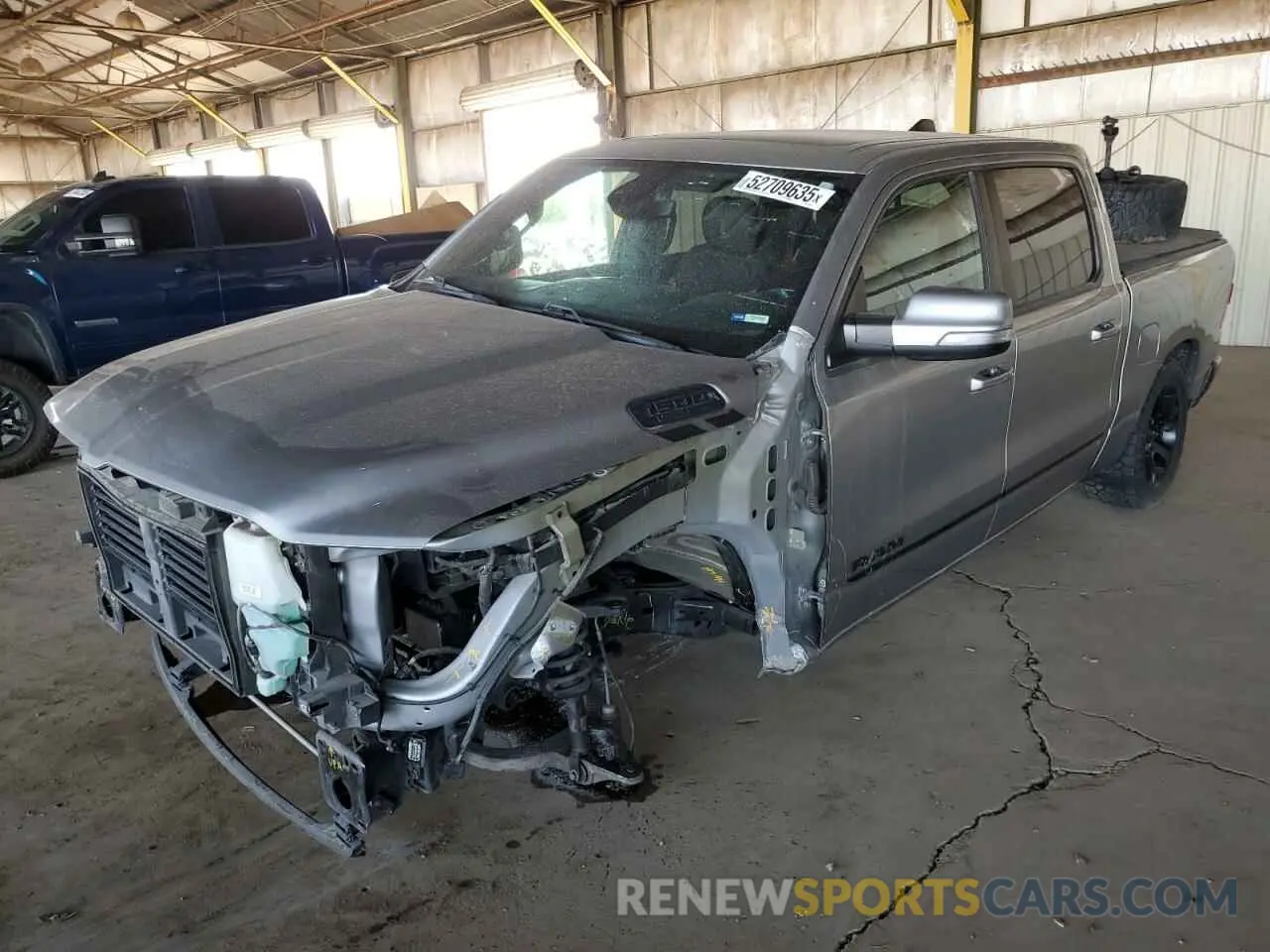 1 Photograph of a damaged car 1C6SRFFT9LN299876 RAM 1500 2020