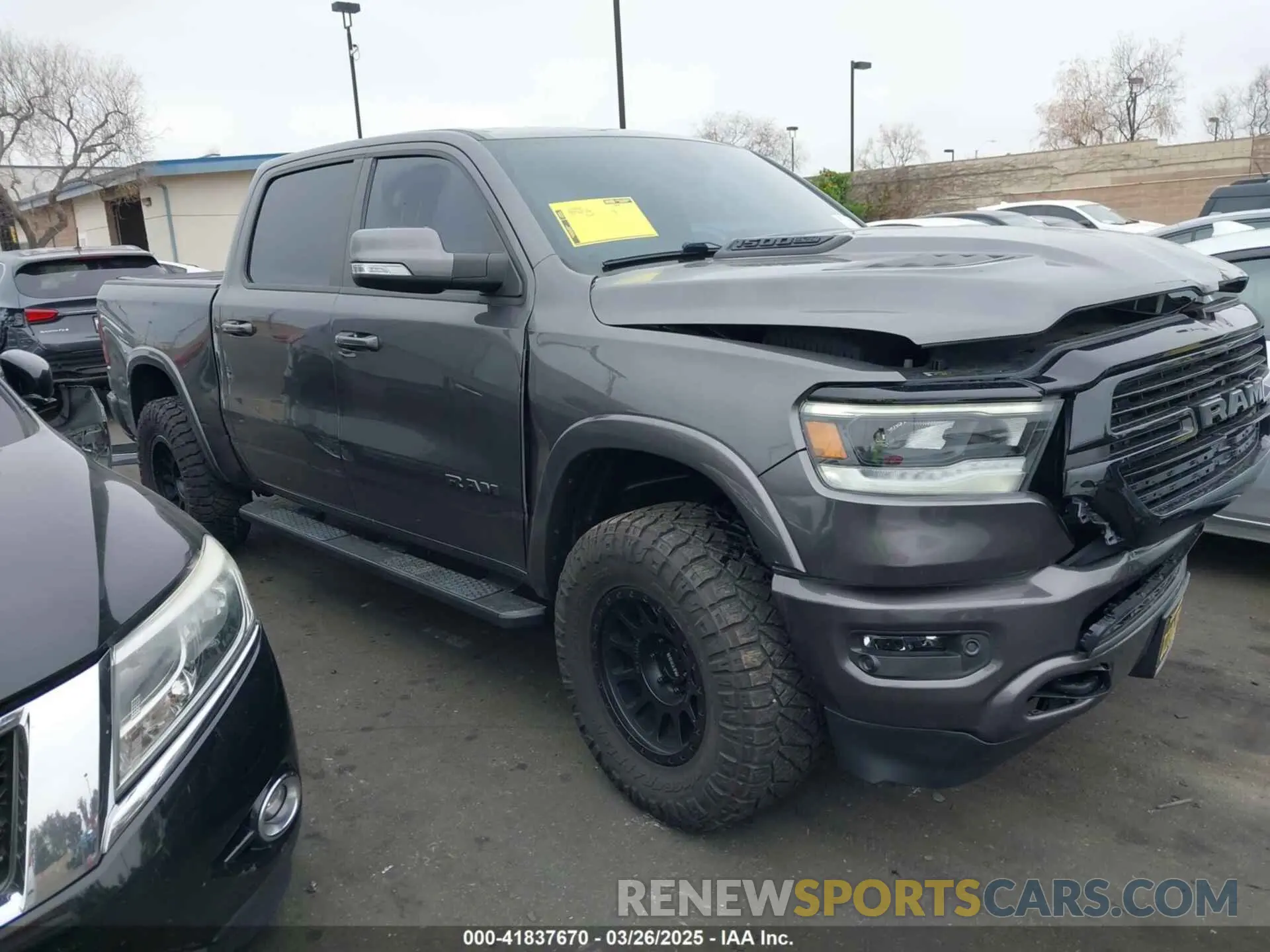 1 Photograph of a damaged car 1C6SRFJTXLN323075 RAM 1500 2020