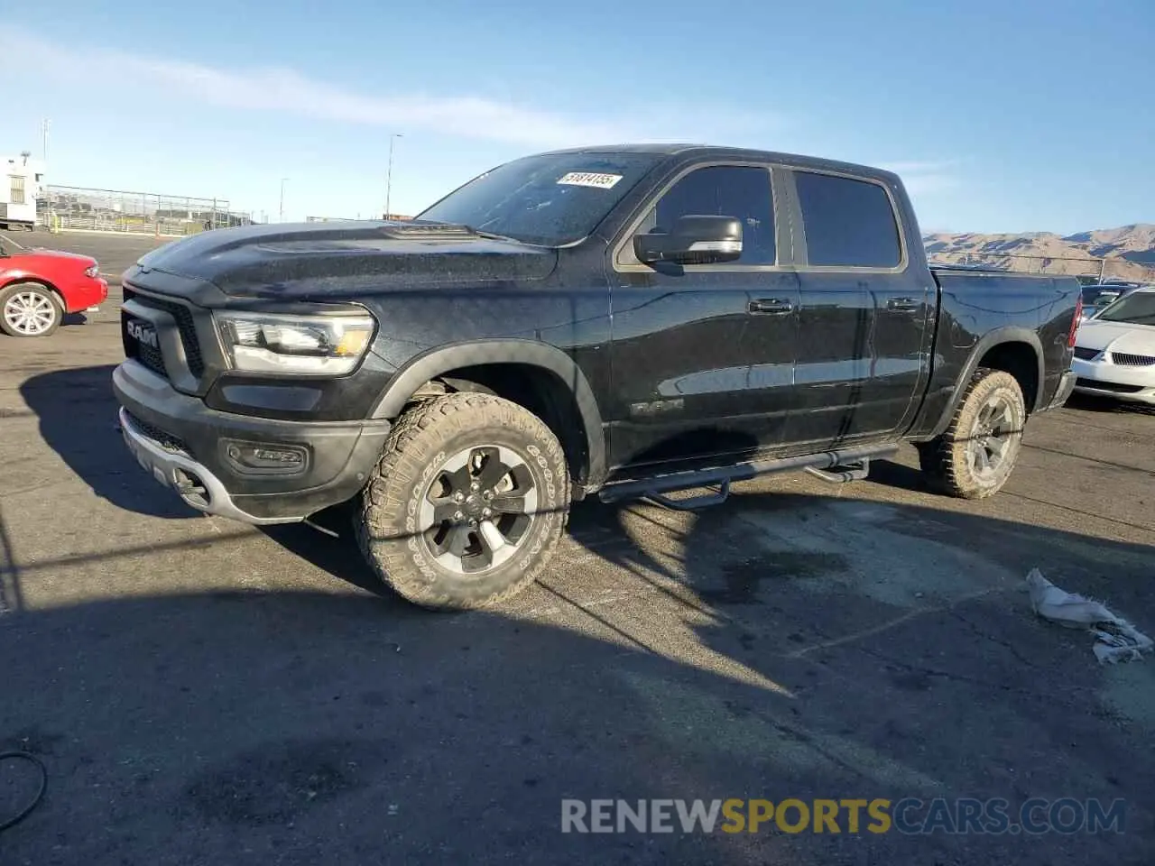 1 Photograph of a damaged car 1C6SRFLT2LN233562 RAM 1500 2020