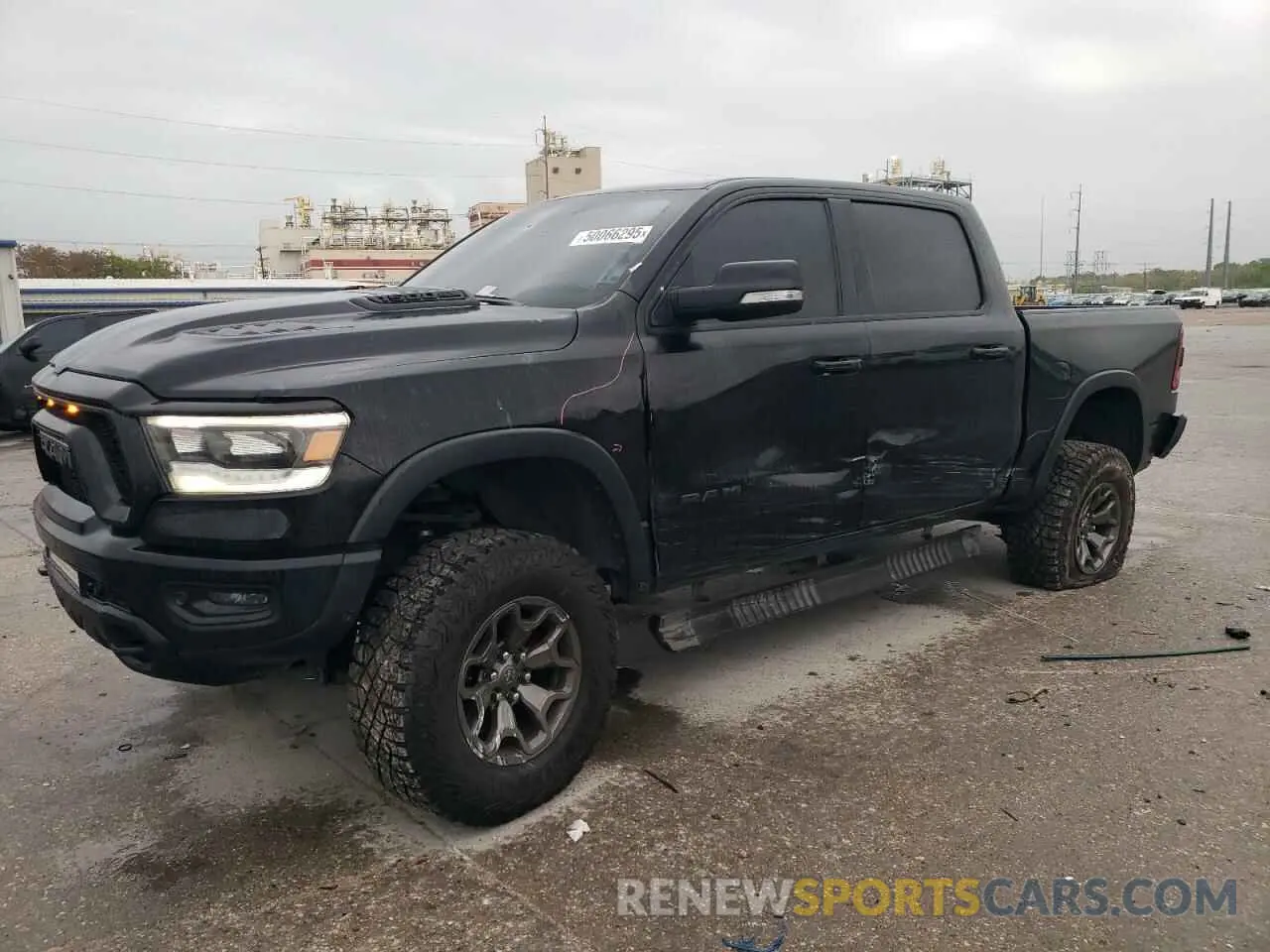 1 Photograph of a damaged car 1C6SRFLT5LN402232 RAM 1500 2020