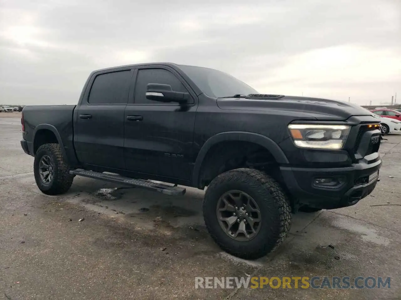 4 Photograph of a damaged car 1C6SRFLT5LN402232 RAM 1500 2020