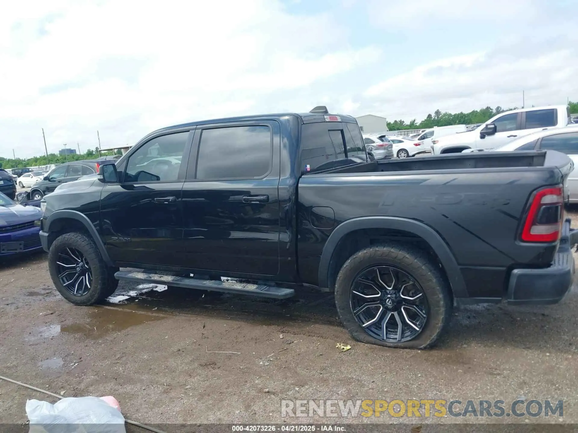 14 Photograph of a damaged car 1C6SRFLT7LN289562 RAM 1500 2020