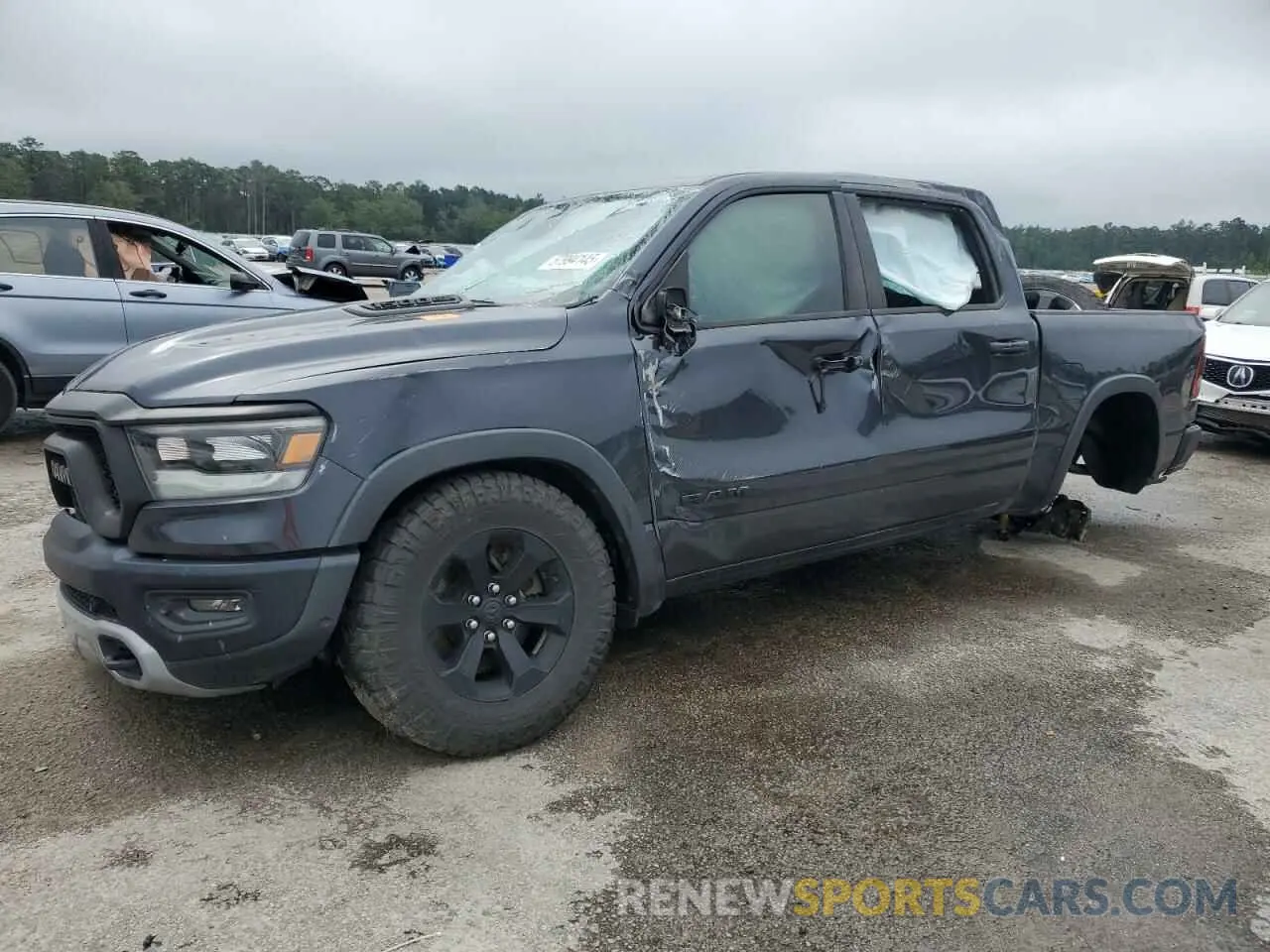 1 Photograph of a damaged car 1C6SRFLT9LN243523 RAM 1500 2020