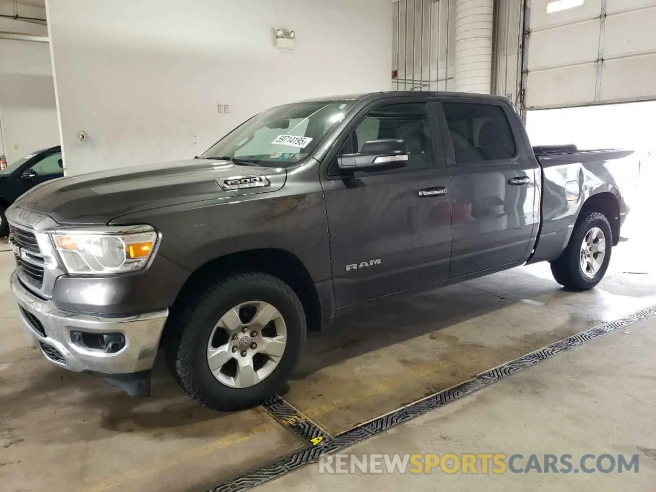 1 Photograph of a damaged car 1C6SRFMT0LN402167 RAM 1500 2020