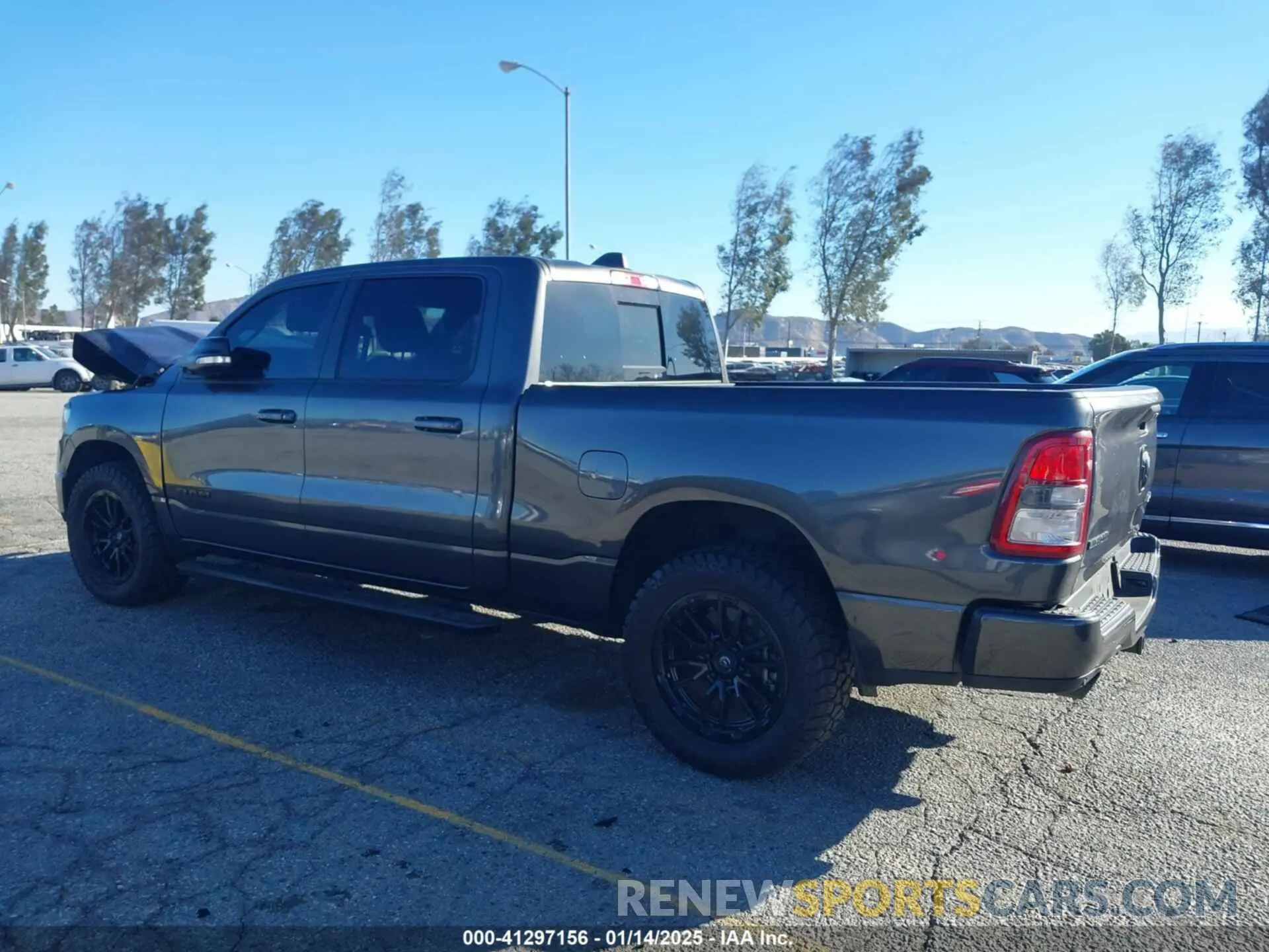 14 Photograph of a damaged car 1C6SRFMT6LN118624 RAM 1500 2020