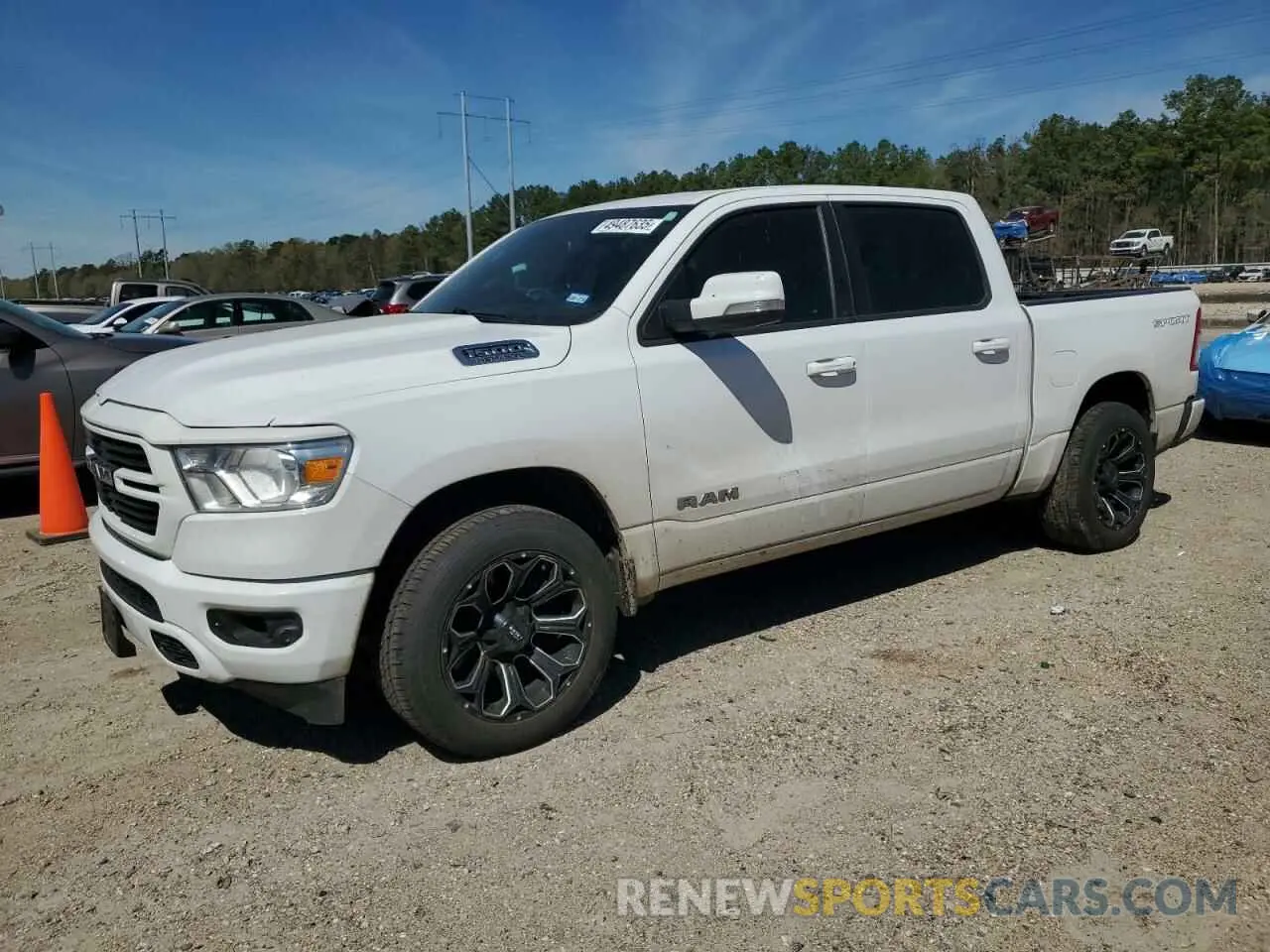 1 Photograph of a damaged car 1C6RREFT1MN653979 RAM 1500 2021