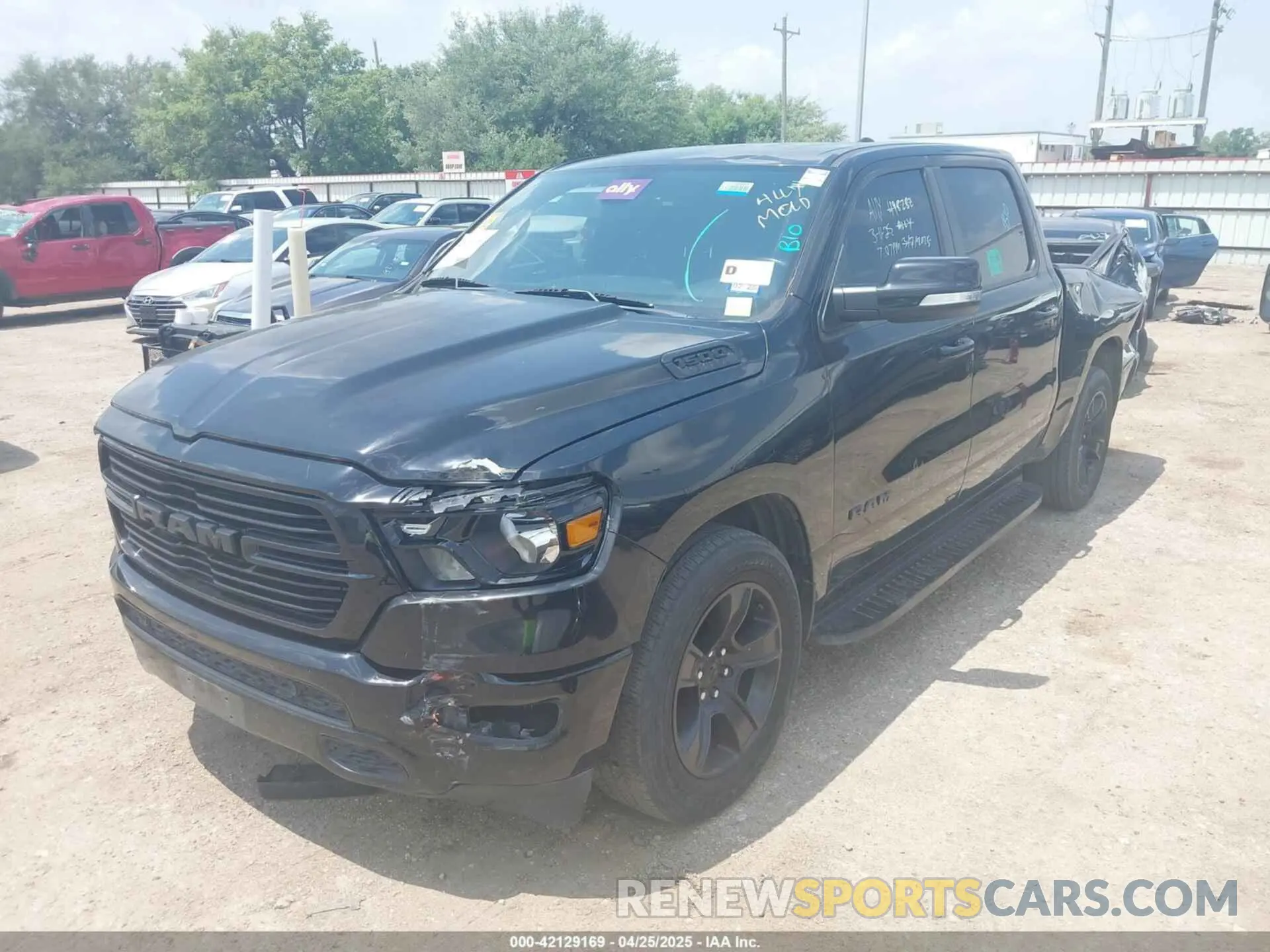 2 Photograph of a damaged car 1C6RREFT3MN647245 RAM 1500 2021