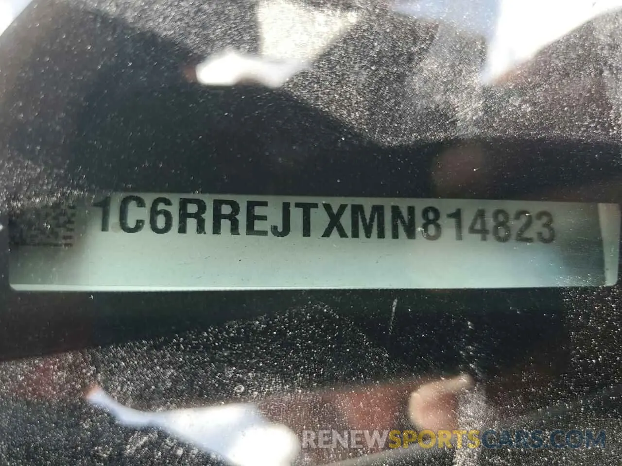 12 Photograph of a damaged car 1C6RREJTXMN814823 RAM 1500 2021