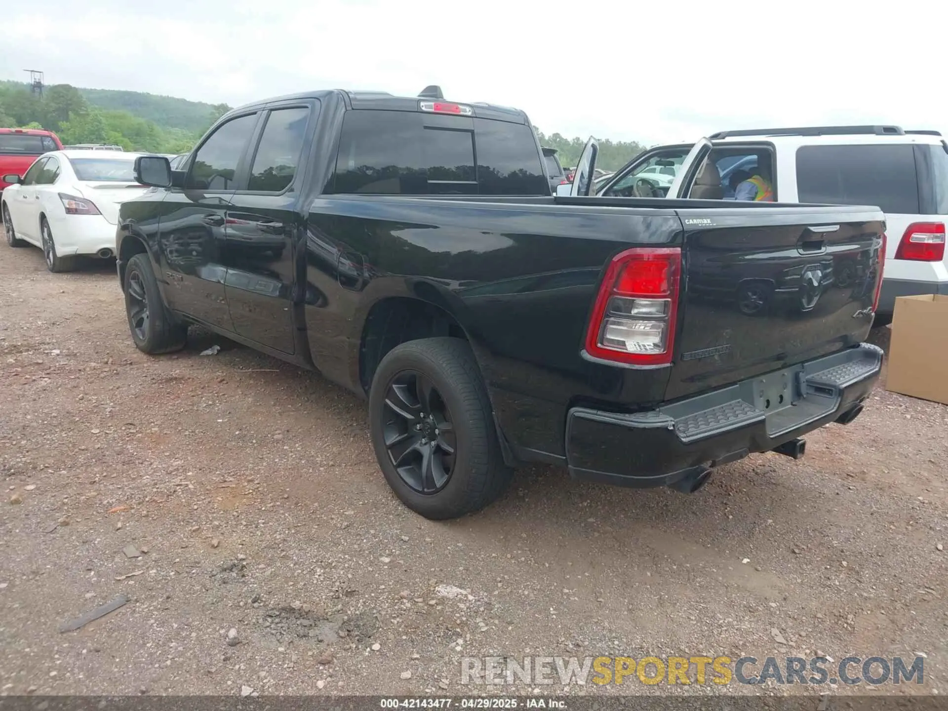 3 Photograph of a damaged car 1C6SRFBTXMN561041 RAM 1500 2021