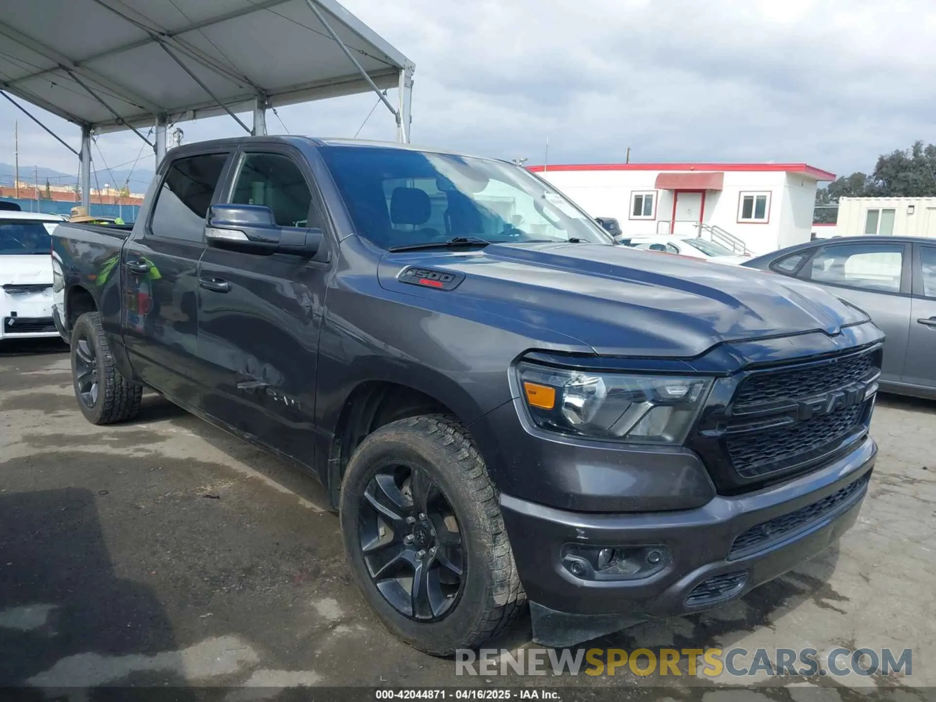 1 Photograph of a damaged car 1C6SRFFM3MN733915 RAM 1500 2021