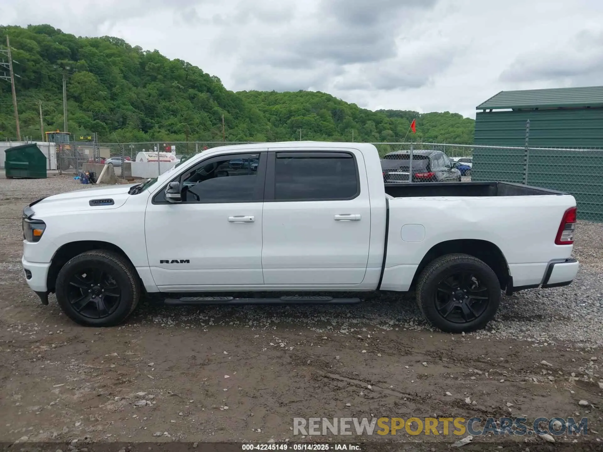 14 Photograph of a damaged car 1C6SRFFT0MN655651 RAM 1500 2021
