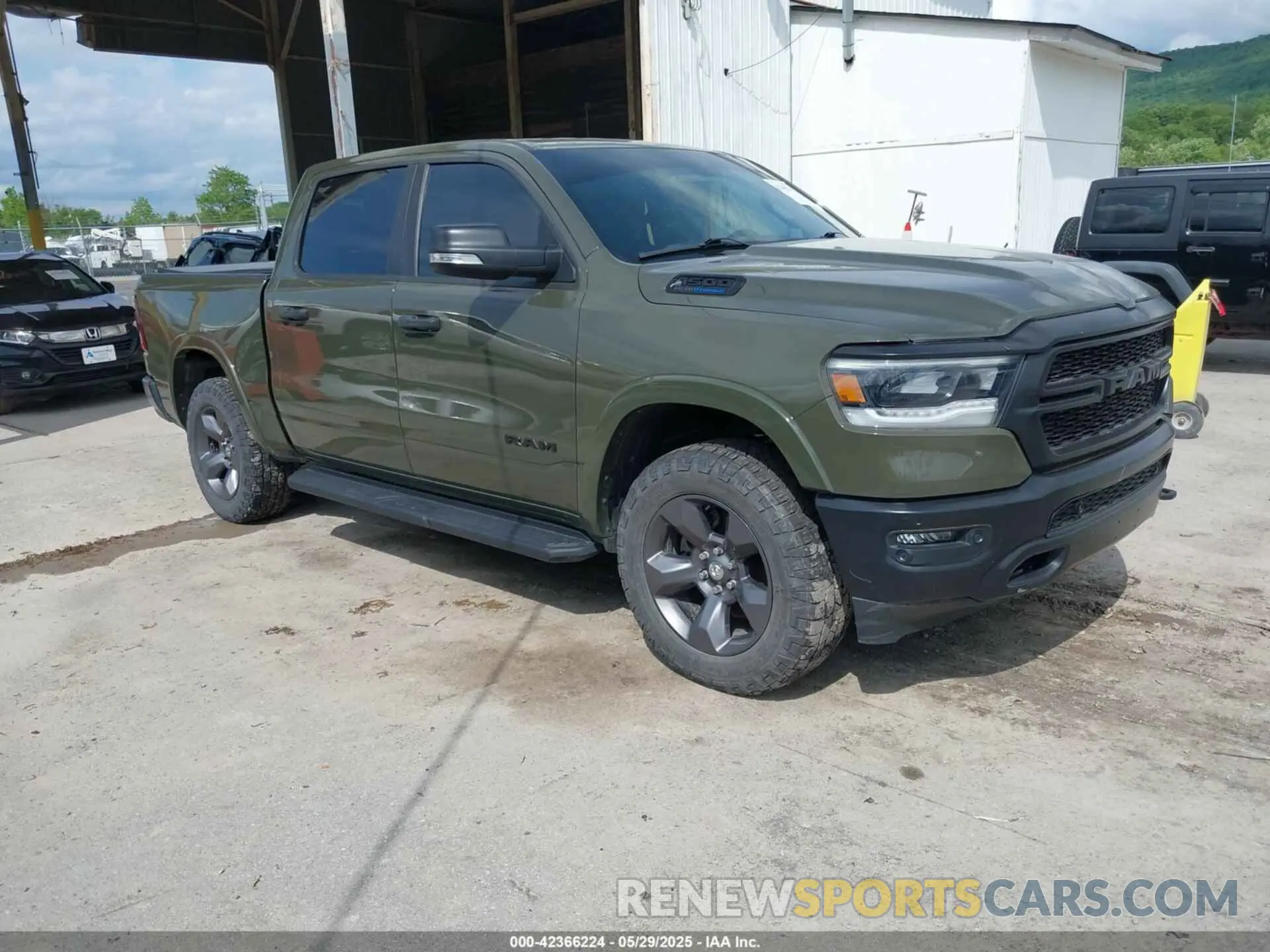 1 Photograph of a damaged car 1C6SRFFT1MN669218 RAM 1500 2021