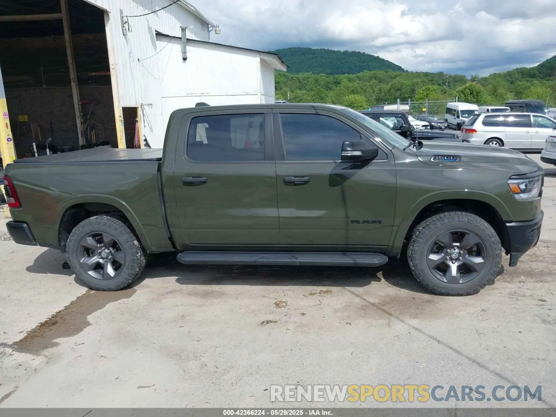 13 Photograph of a damaged car 1C6SRFFT1MN669218 RAM 1500 2021
