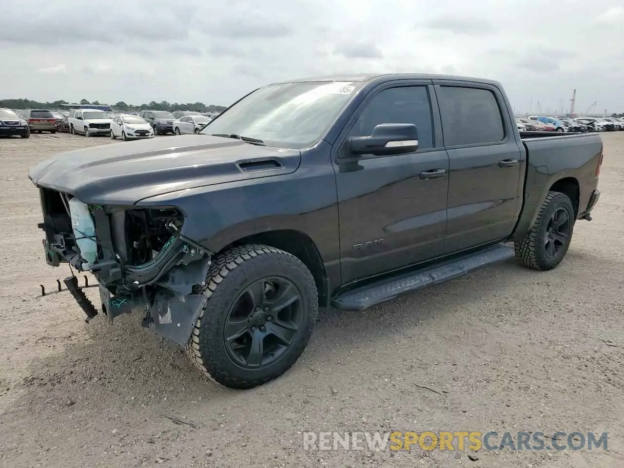 1 Photograph of a damaged car 1C6SRFFT2MN766640 RAM 1500 2021