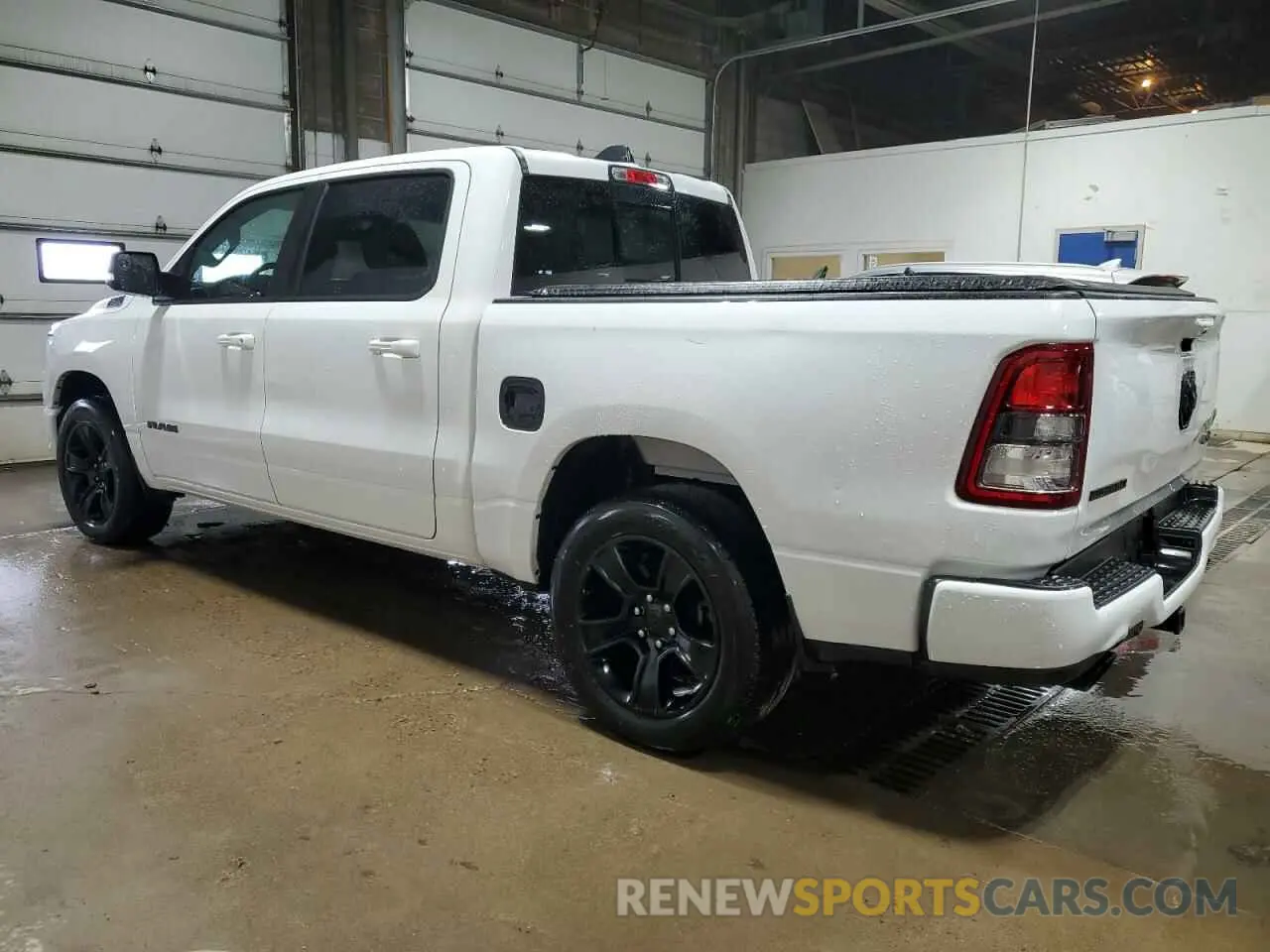 2 Photograph of a damaged car 1C6SRFFT3MN675148 RAM 1500 2021